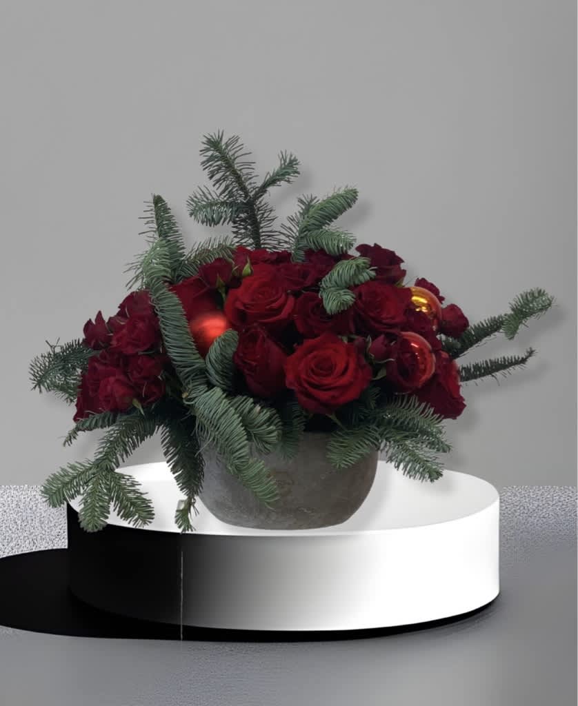 Santa tell me  - This elegant arrangement will set a holiday tone for any home or office. Full of red rose and holiday greenery, it will add a nice touch of Christmas decor to the room