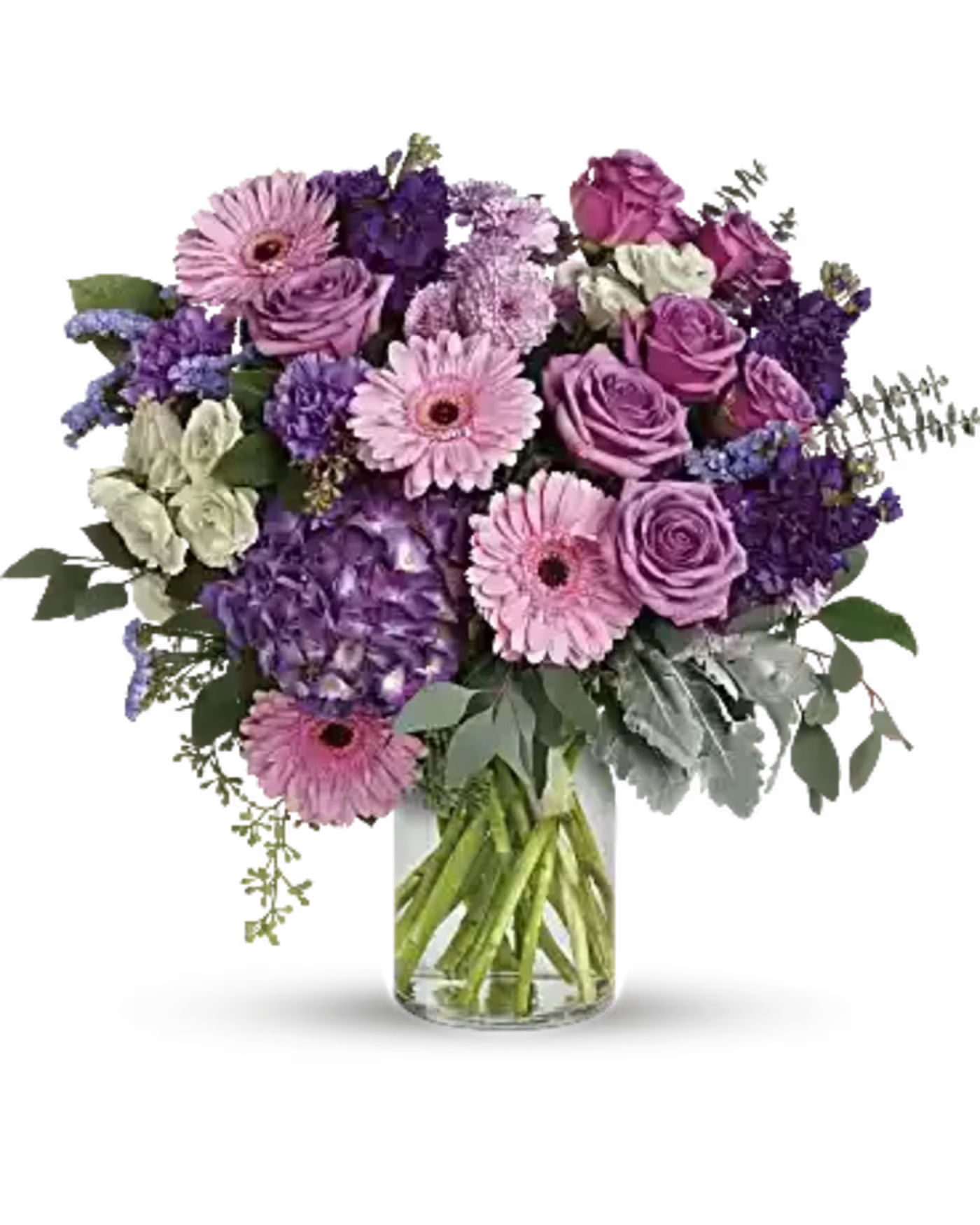 Magnificent Mauve - Bring beauty to any occasion with the deep purples and playful pinks of this breathtaking bouquet. This magnificent bouquet features purple hydrangea, lavender roses, crème spray roses, pink gerberas, lavender carnations, purple stock, lavender cushion spray chrysanthemums, lavender sinuata statice, dusty miller, spiral eucalyptus, seeded eucalyptus, silver dollar eucalyptus, and lemon leaf.