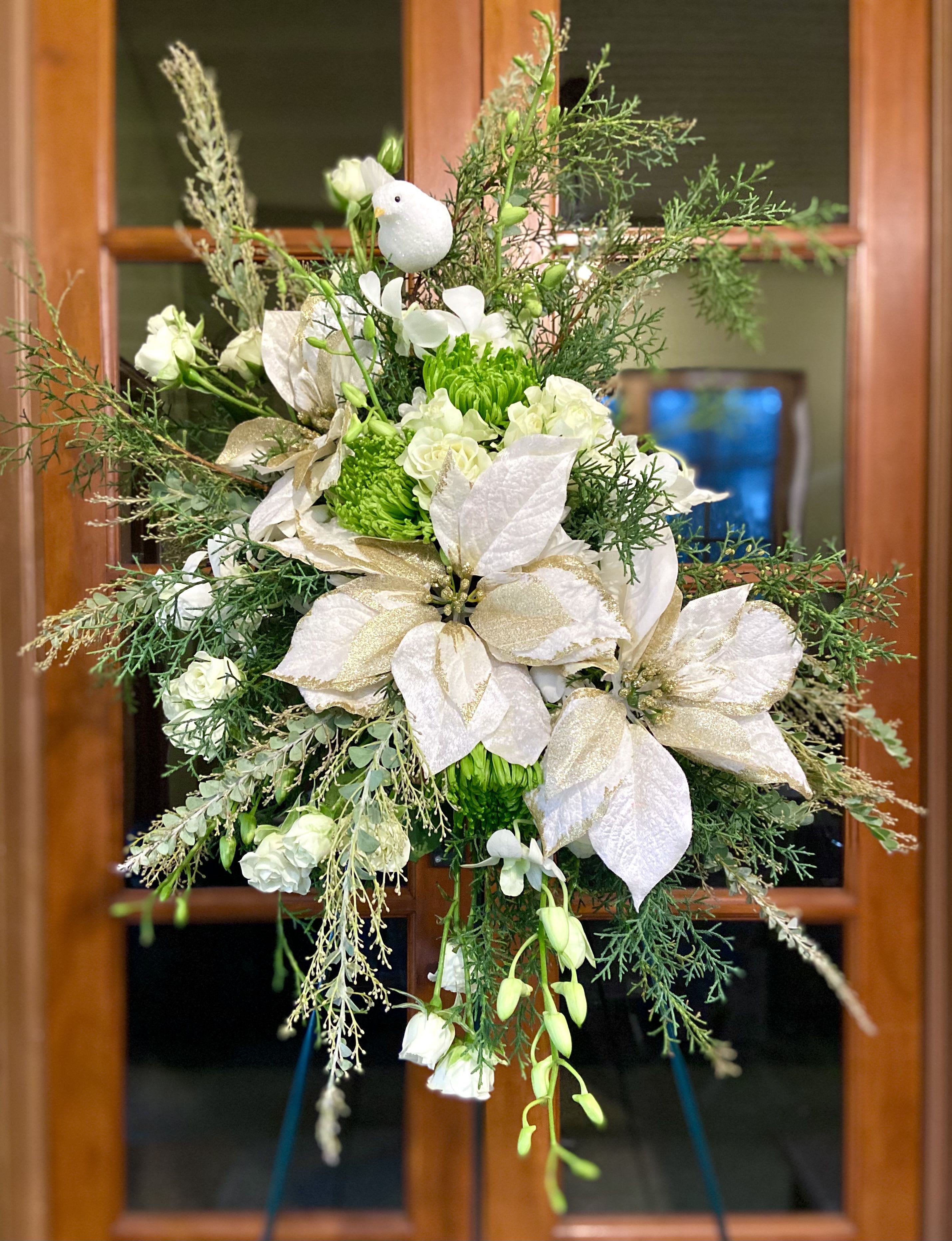 Reaching Towards Heaven - Seasonal florals and greenery reach towards the heavens to memorialize your loved one.  Appropriate for memorial and funeral services.