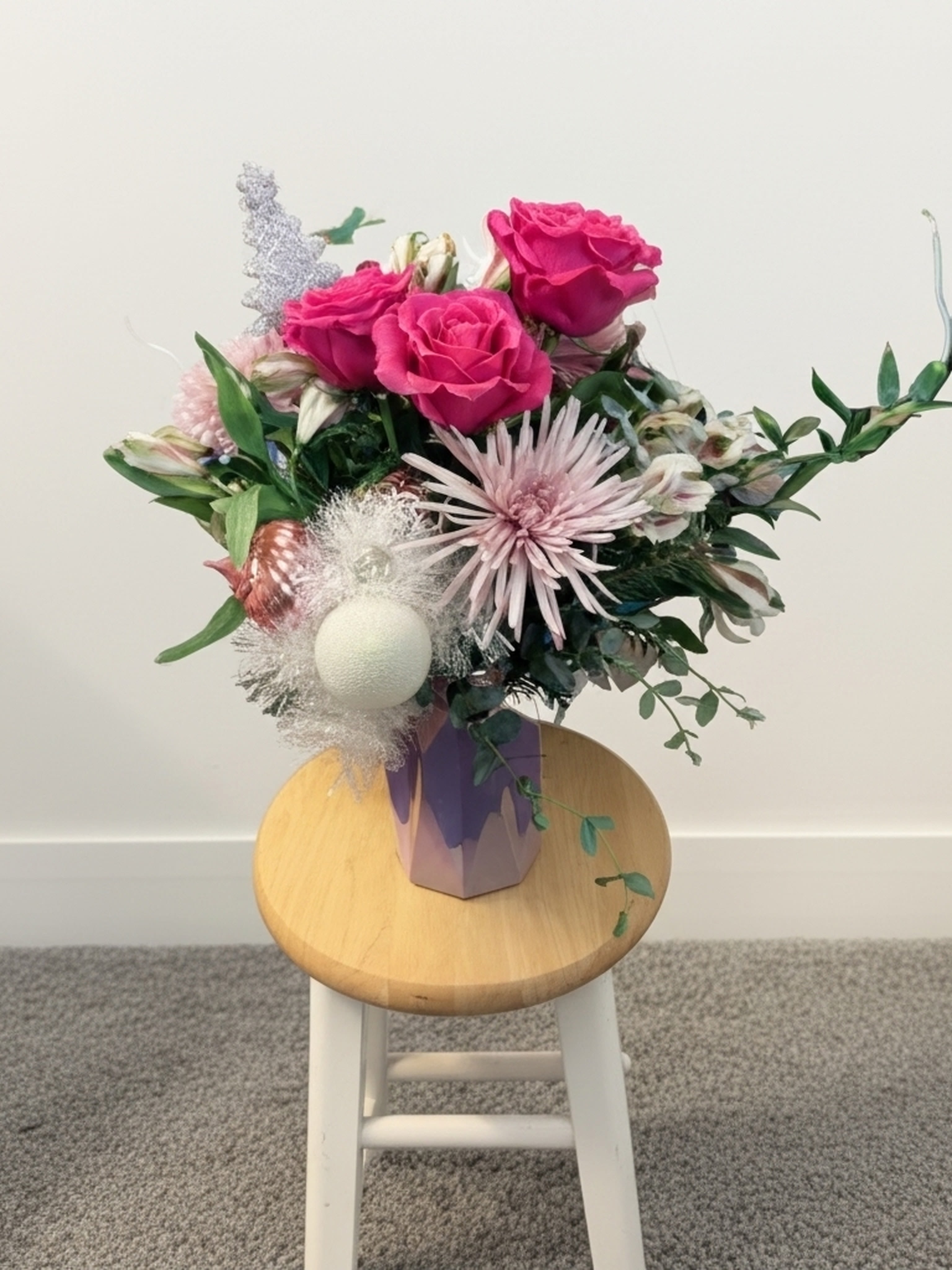 Pink Frost - A pink frosty twist on the tradition Christmas arrangement. Perfect for that special someone who can't get enough pink in their lives.