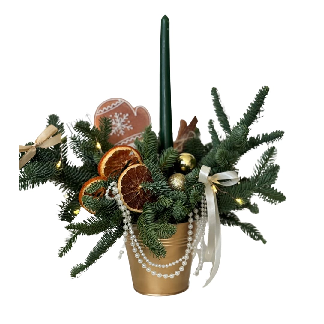 Orange Spice - A chic holiday centerpiece featuring fresh evergreen branches in a gold pot, styled with a green taper candle, gold ornaments, dried orange slices, and cozy cinnamon accents. Finished with soft ribbons + pearl garland for that elegant “holiday dinner table” look. Perfect for tables, entryways, gifting, or hostess presents.