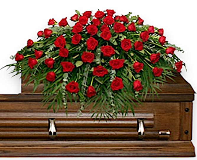 Majestic Red Casket Spray - This elegant sympathy arrangement showcases an abundant display of 60 radiant red roses, symbolizing deep love, respect, and remembrance. Nestled amidst lush foliage, the rich green hues of eucalyptus and leather leaf add a soothing backdrop that enhances the roses' vibrant hues. The teepee foliage contributes structure and a natural elegance, framing the roses beautifully while evoking a sense of comfort and warmth. This timeless tribute encapsulates heartfelt emotions, offering solace to those who are grieving, and serves as a powerful reminder of the enduring love and cherished memories shared with the departed.