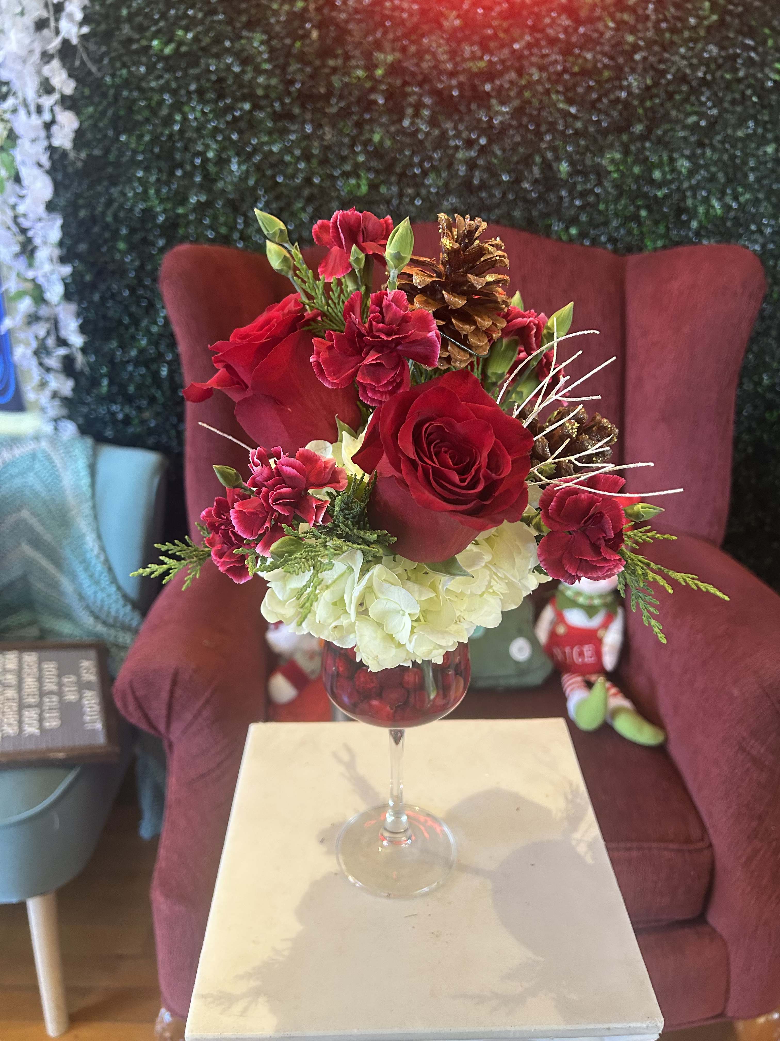 Cranberry Mistletoe - A beautiful mix of white and red flowers with real cranberries in the wine glass.