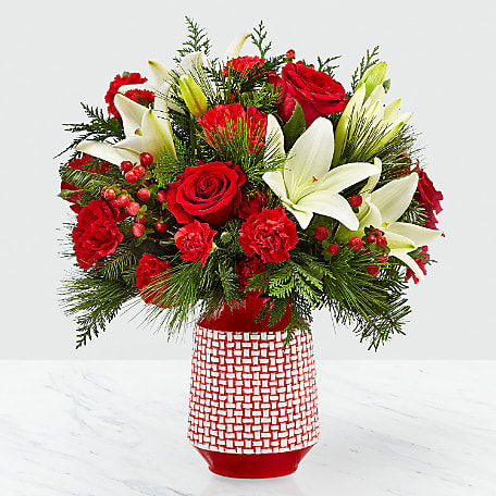 Sweet Joy... vase will be chosen by the designer - Hues of red are contrasted with bursts of white to make a bouquet that is sweet and beautiful. With classic red roses and red carnations, the bold white Asiatic lilies give the Sweet Joy Bouquet a refined look that will leave the recipient with a smile on their face. The red ceramic vase they arrive in boasts a raised white woven pattern. GOOD bouquet is approx. 15"H x 14"W. BETTER bouquet is approx. 16"H x 14"W. BEST bouquet is approx. 18"H x 15"W. EXQUISITE bouquet is approx. 18"H x 16"W.