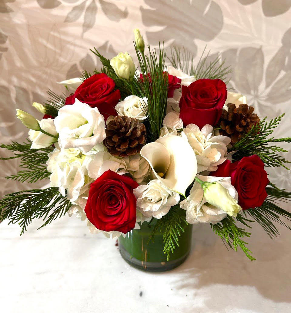 Peppermint - Seasonal white and red flowers with holiday greens. Perfect for the holiday season! Flowers subject to availability. 