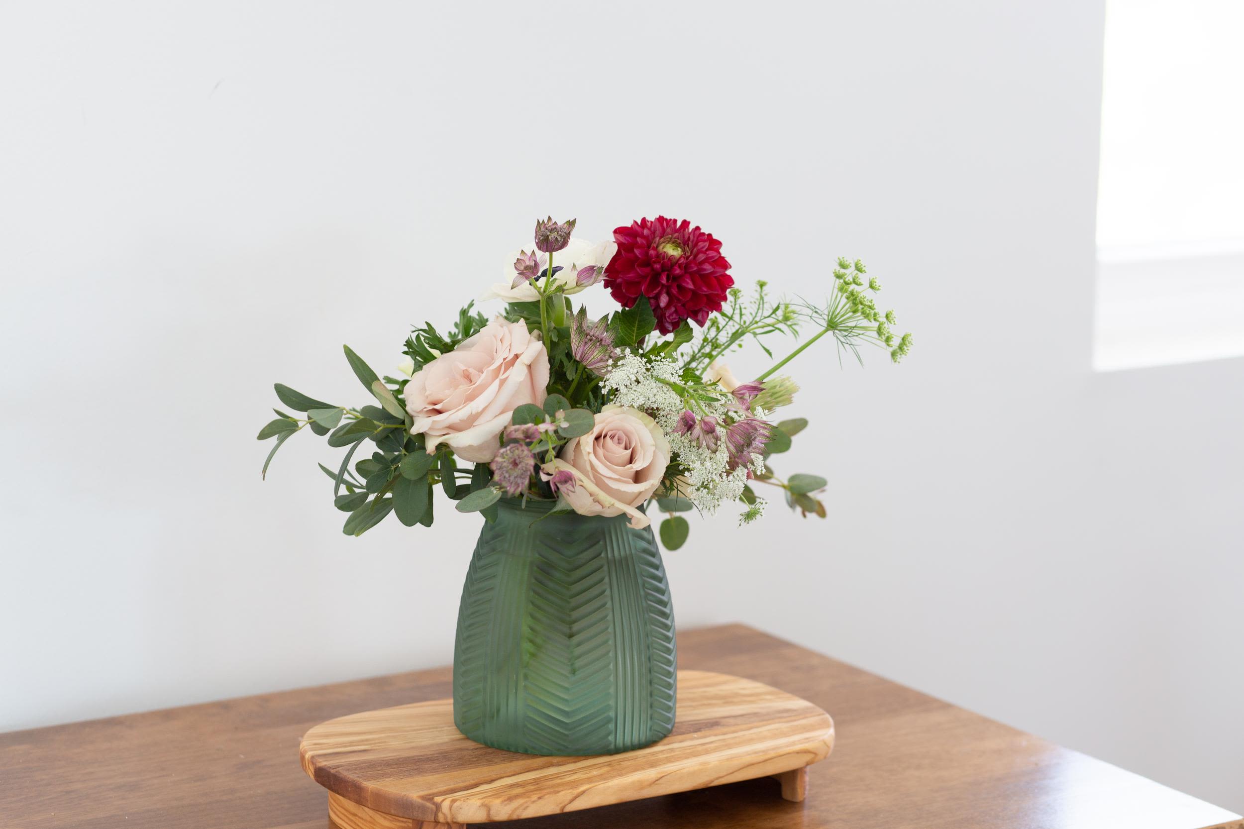 Blush &amp; Ruby Floral Arrangement – Same-Day Flower Delivery - A refined floral arrangement blending soft blush roses and deep crimson blooms, accented with delicate textures and fresh greenery. Designed in a neutral vase for a timeless, elegant look.  Perfect for New Year’s celebrations, intimate gatherings, or thoughtful seasonal gifting. Flower varieties and vase style may vary slightly based on availability while maintaining overall color palette, style, and value.