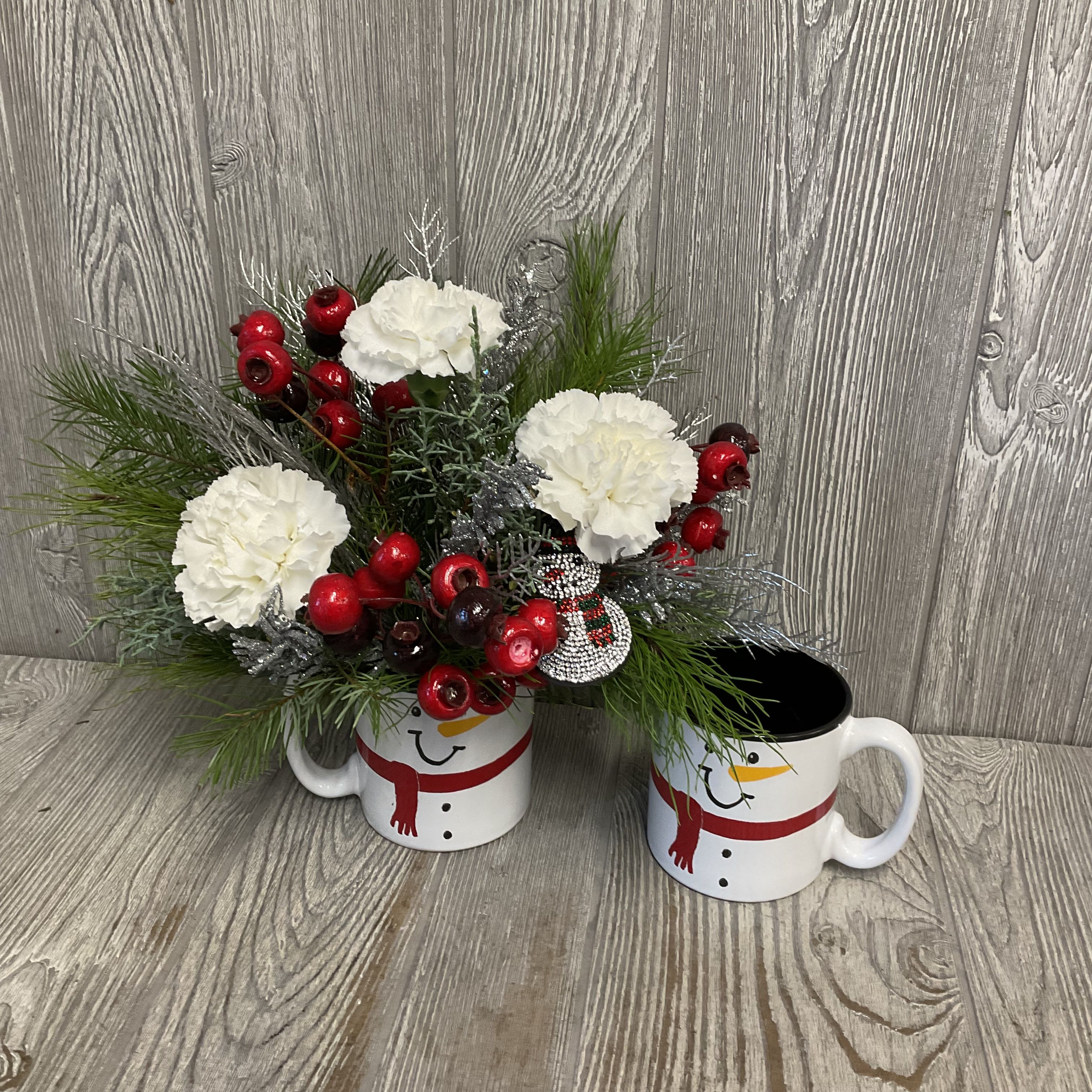 Snowball - Fresh cut flowers arranged in a keepsake ceramic snowman mug! Includes a festive snowman keychain! Colors and flowers can vary. 