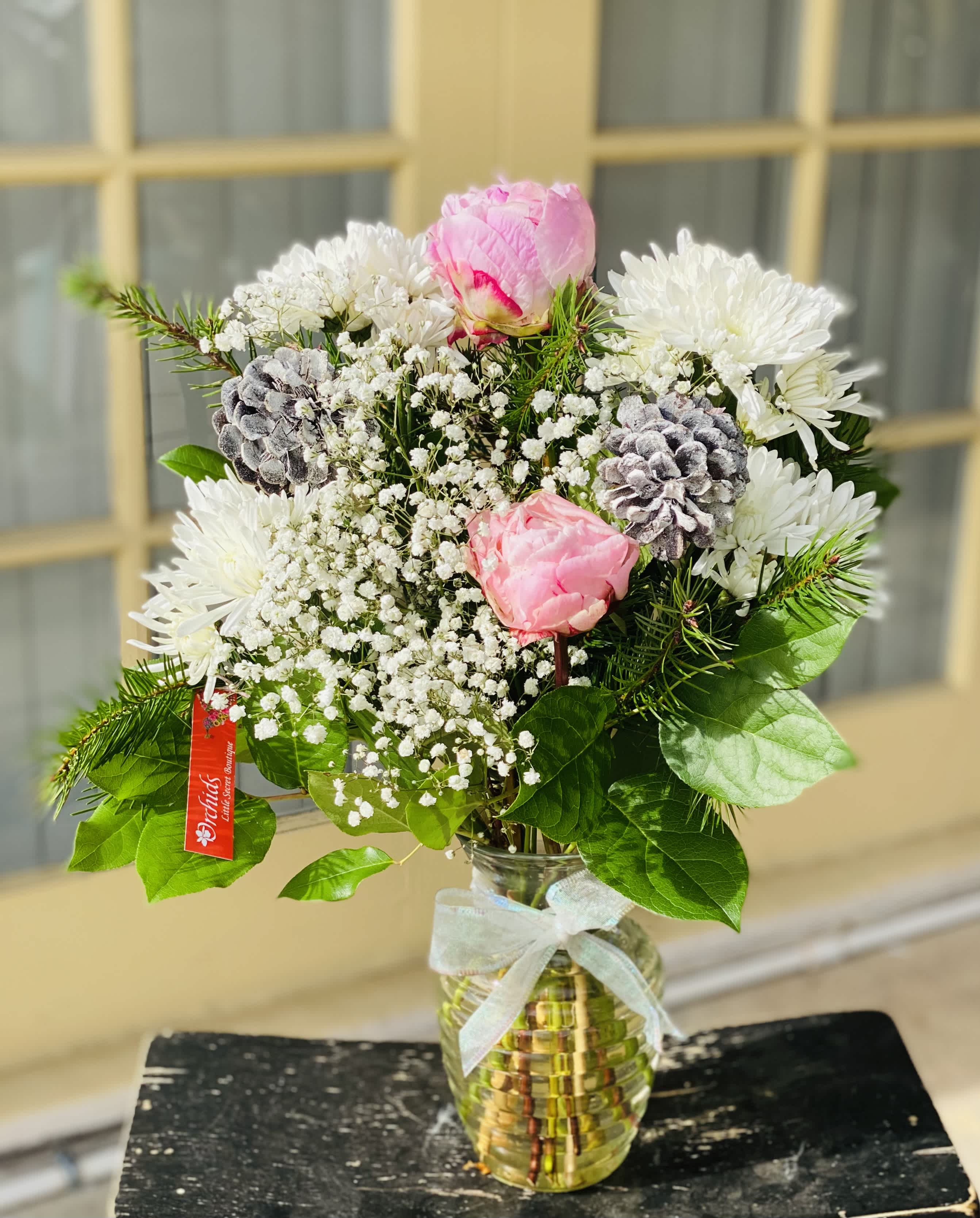 Peony Winter Glamour Bouquet  - Bring a smile to a loved one's face this winter season, with a glamour and naturally elegant Peonies bouquet! With decorative pine cones, white blooms  and winter greens.  