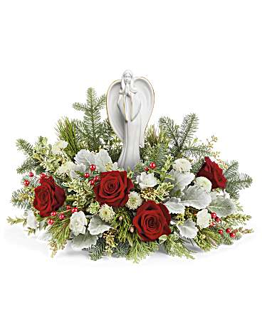 Blessed Serenity Bouquet - Embodying the spirit of Christmas, the Angel of Grace rests among a bed of red and white blooms, illuminating your special occasion with joy and light.