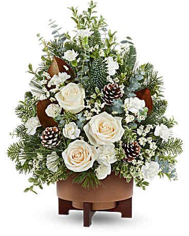 Alpine Snow Tree - Teleflora's Alpine Snow Tree brings peaceful winter beauty with white roses, snowy greens, and pinecones in Teleflora's Modern Copper Planter. This floral tree makes a serene Christmas gift or elegant holiday centerpiece. 