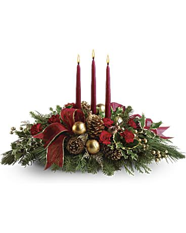 All Is Bright - All is calm, all is bright…well, at least we can promise the latter with this luminous arrangement! Gather family and friends together for a holiday meal around this traditional Christmas centerpiece featuring pinecones, holly, noble fir and Christmas candles. 'Tis the season to shine! 