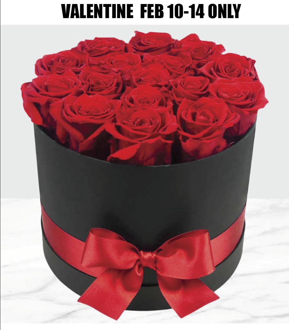 RED ROSES IN A HAT BOX - Beautiful Freedom Red Roses in an elegant black hat box. Ultimate symbol of love.