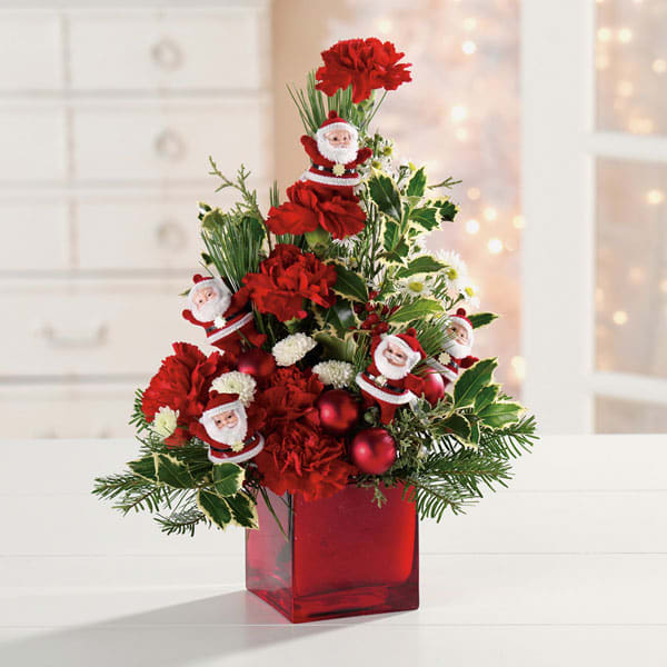 Tabletop Santa Tree - Adorable Santa Claus ornaments and holiday baubles decorate this tabletop tree. Will bring the holiday spirit into any home or office.