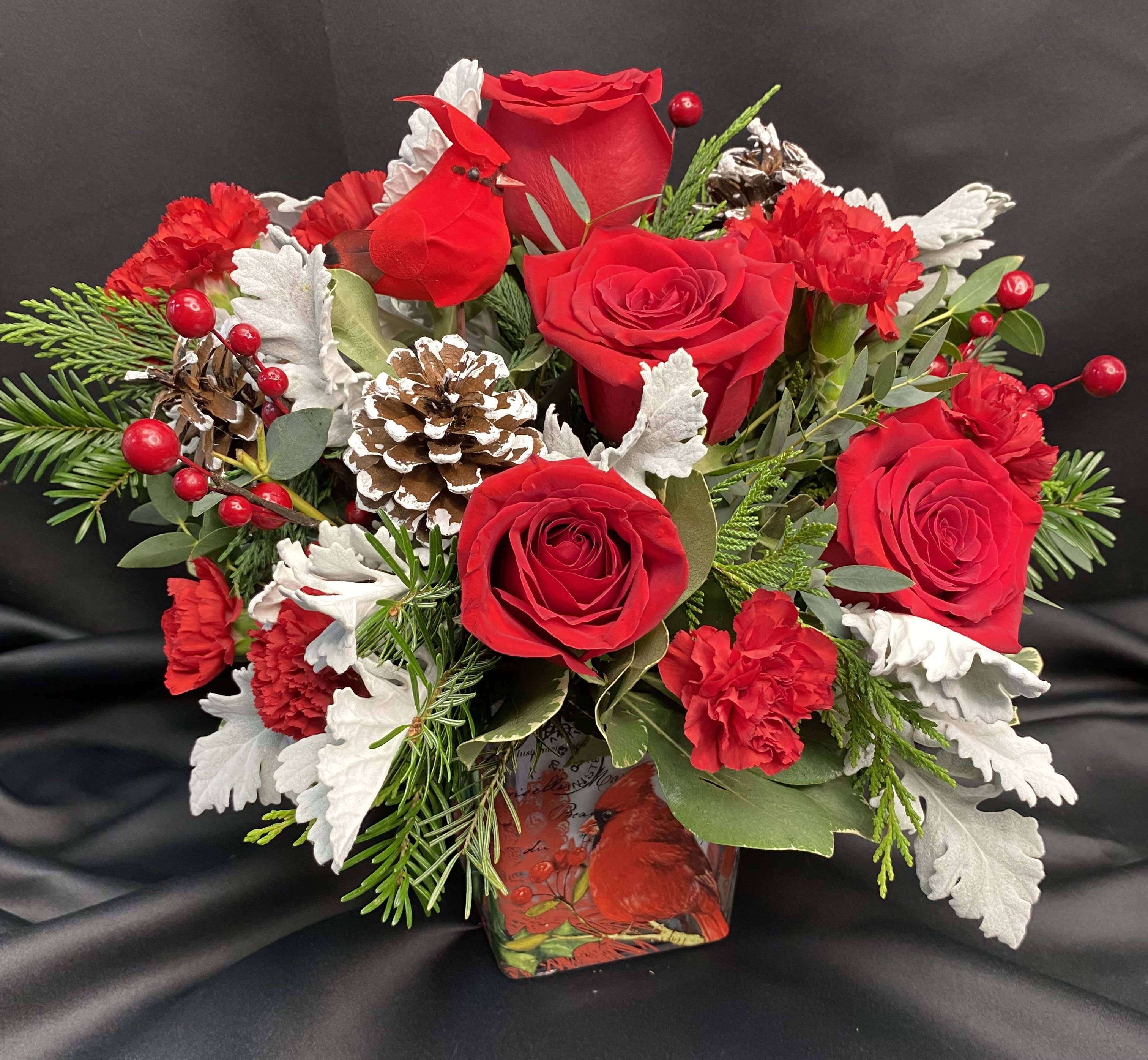 Cardinal Cheer Bouquet - Paint a magical holiday scene with this classic Christmas bouquet, arranged in a vintage-inspired glass keepsake adorned with a cheerful cardinal. Later, it's a lovely candleholder. 