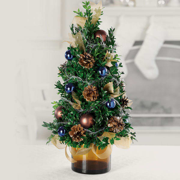 Rustic Home Tabletop Tree - Gold, bronze and blue ribbons and balls with pinecones will bring a rustic holiday feel to any home or office.