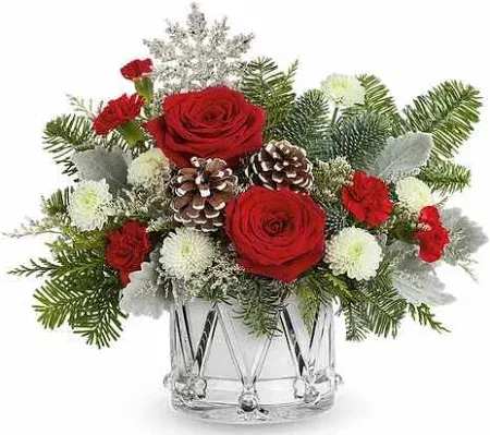 Little Drummer Boy Bouquet - March into the holidays with this wonderful keepsake crystal drum. It will make a lasting memory for years to come. Filled with wonderful holiday greens and flower it will make a terrific gift. Delivery for home, delivery for and office here in Kissimmee, St. Cloud or the Disney Resort area. This one will filled the home with joy.