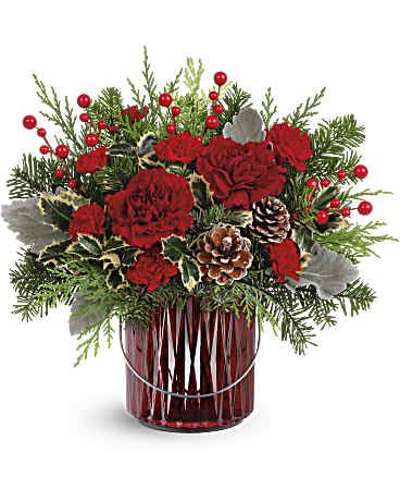 Merry Glow Bouquet - Illuminate your holiday festivities with this enchanting Christmas bouquet, elegantly arranged in a red glass lantern. Later, it doubles as a beautiful candleholder, bringing a warm and festive glow to your home décor. 