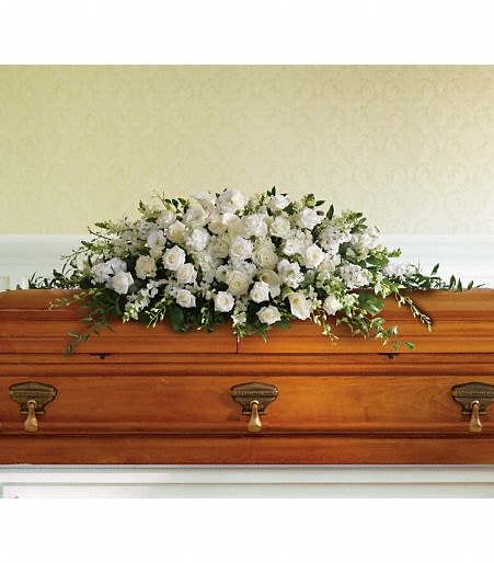 Full Casket Spray - Provide a peaceful and heartfelt display of blooms for a loved one’s place of rest. Roses, lilies, and more come together for a bursting casket spray in colors of your choosing.  Please include the following in "Special Instructions":  - Color preferences - Script requests (i.e. Loving Mother, Beloved Uncle, etc.) - Delivery instructions - Time the viewing begins
