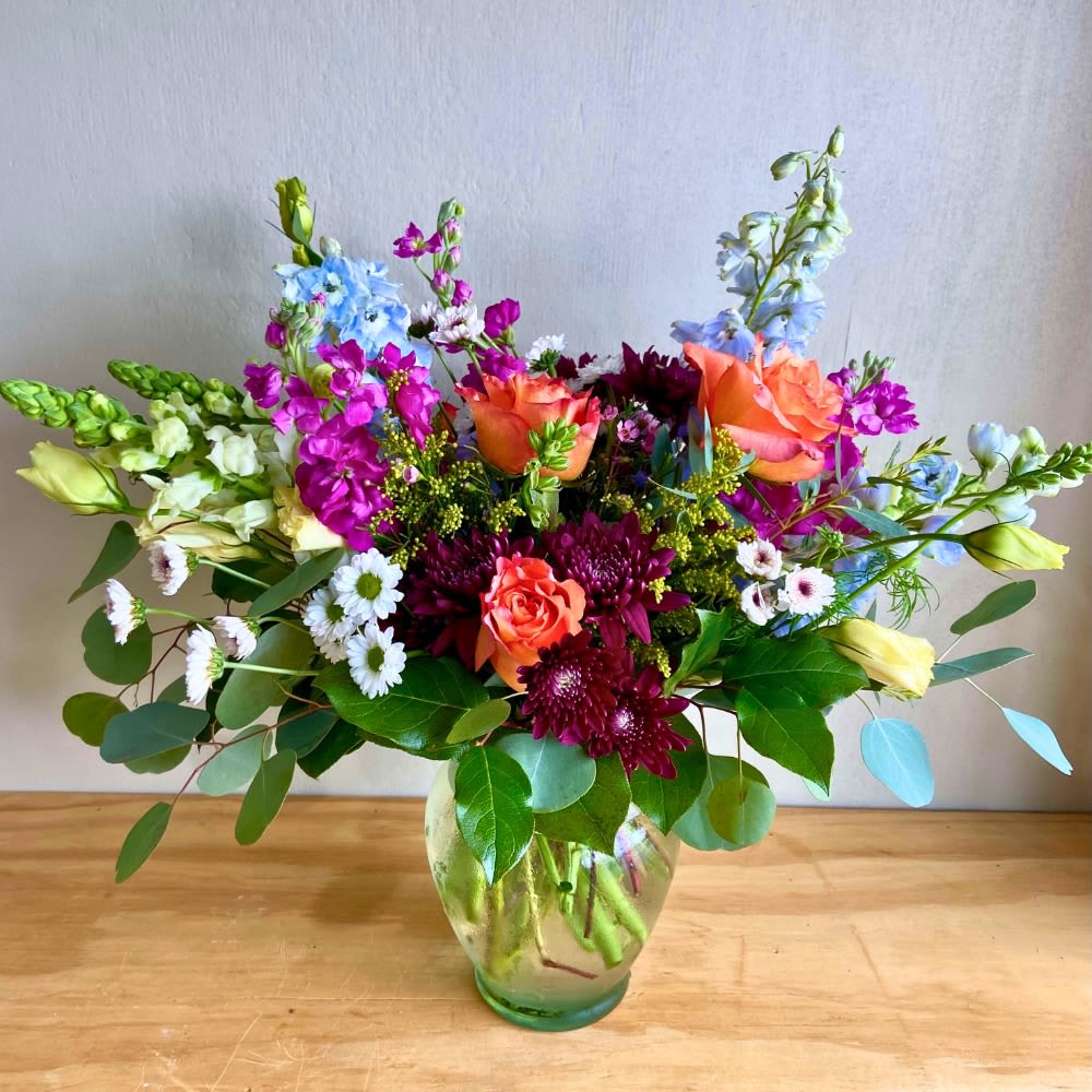 Cathy's Flower Creation  - Enhance the ambiance of your living space with our exquisite vase filled with a vibrant assortment of colorful flowers. This stunning centerpiece will add a touch of elegance and freshness to any room, making it the perfect addition to your home decor.  A unique arrangement hand created by our experienced designers. Please note that every design is custom made and substitution to container and flower types may happen from time to time. Design aspects will always stay the same, but if needed, we will substitute with flowers of equal or greater value to offer you a great floral shopping experience! Our flowers are 100% guaranteed. Please call us with any questions or concerns.