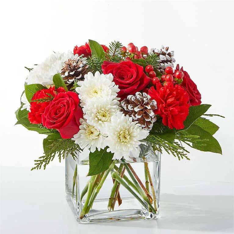 Snow Angel Bouquet - A delicate balance of red and white florals accented with seasonal greens to brighten their day.