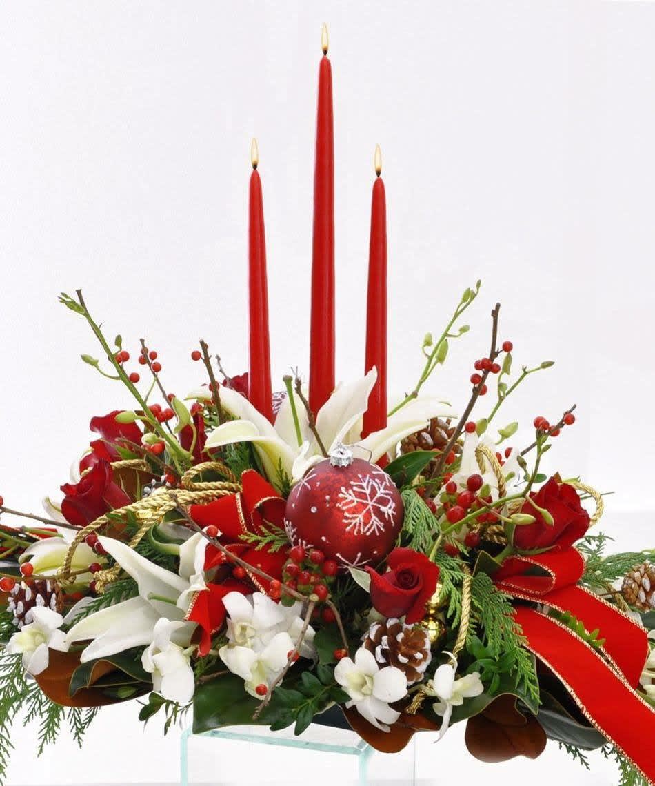 Christmas decoration- centerpice - This lovely centerpiece featuring roses, orchids, lilies, berries, evergreen, pine cones, ornaments and taper candles will be the perfect focal point of your holiday table. 