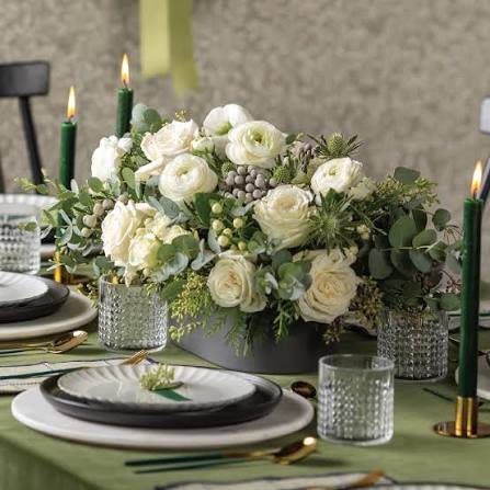 Christmas vase arrangement  - A beautiful designer’s choice arrangement with seasonal blooms, adorned with fresh Christmas greenery!