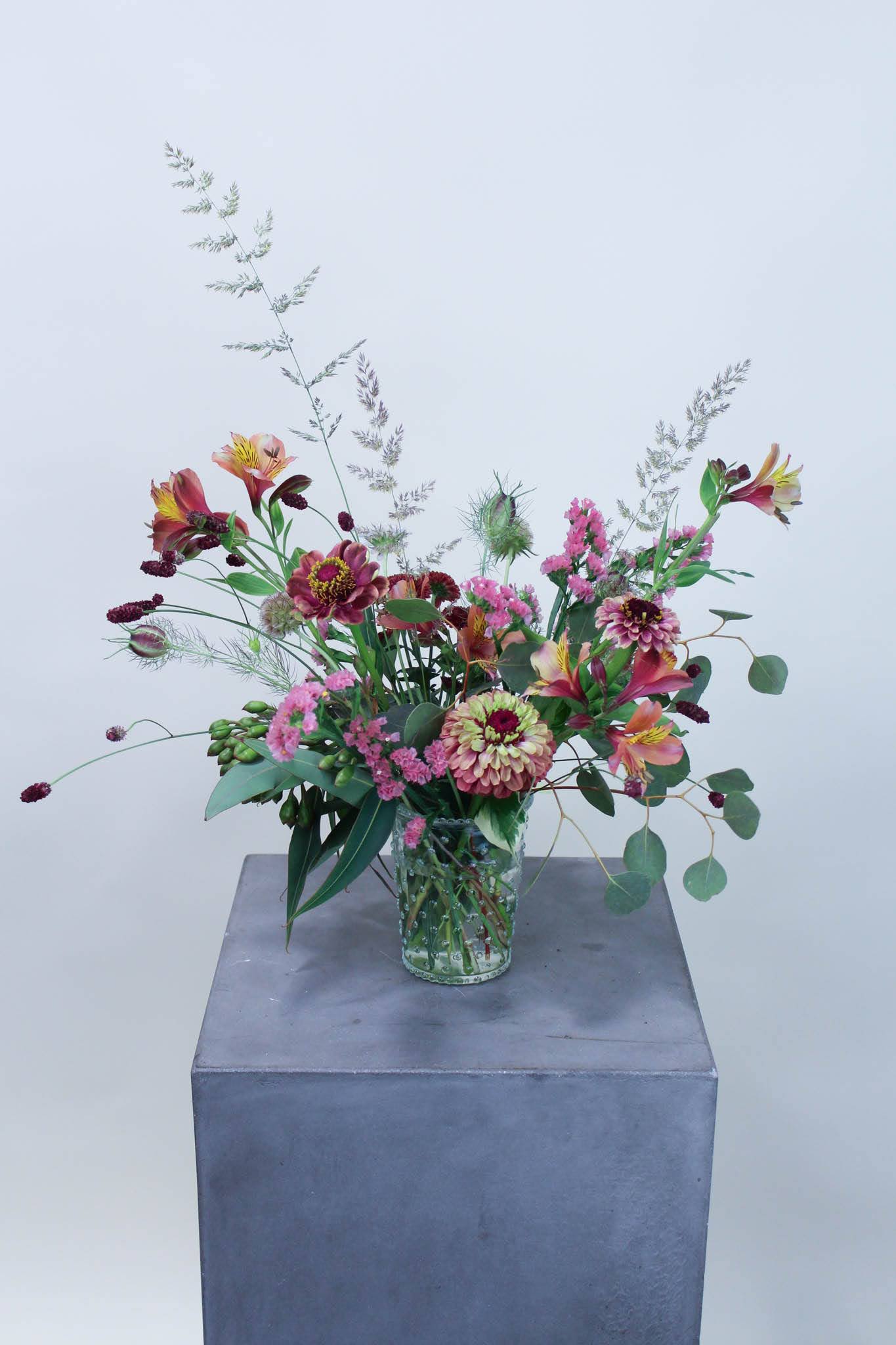 Garden Picked - Using texture, shape and color, this small wild flower bouquet is perfect for a thoughtful gift, the home, or office.   *Images are a representation of our design style. Each arrangement is made to order and will vary based on product availability the week of your order.