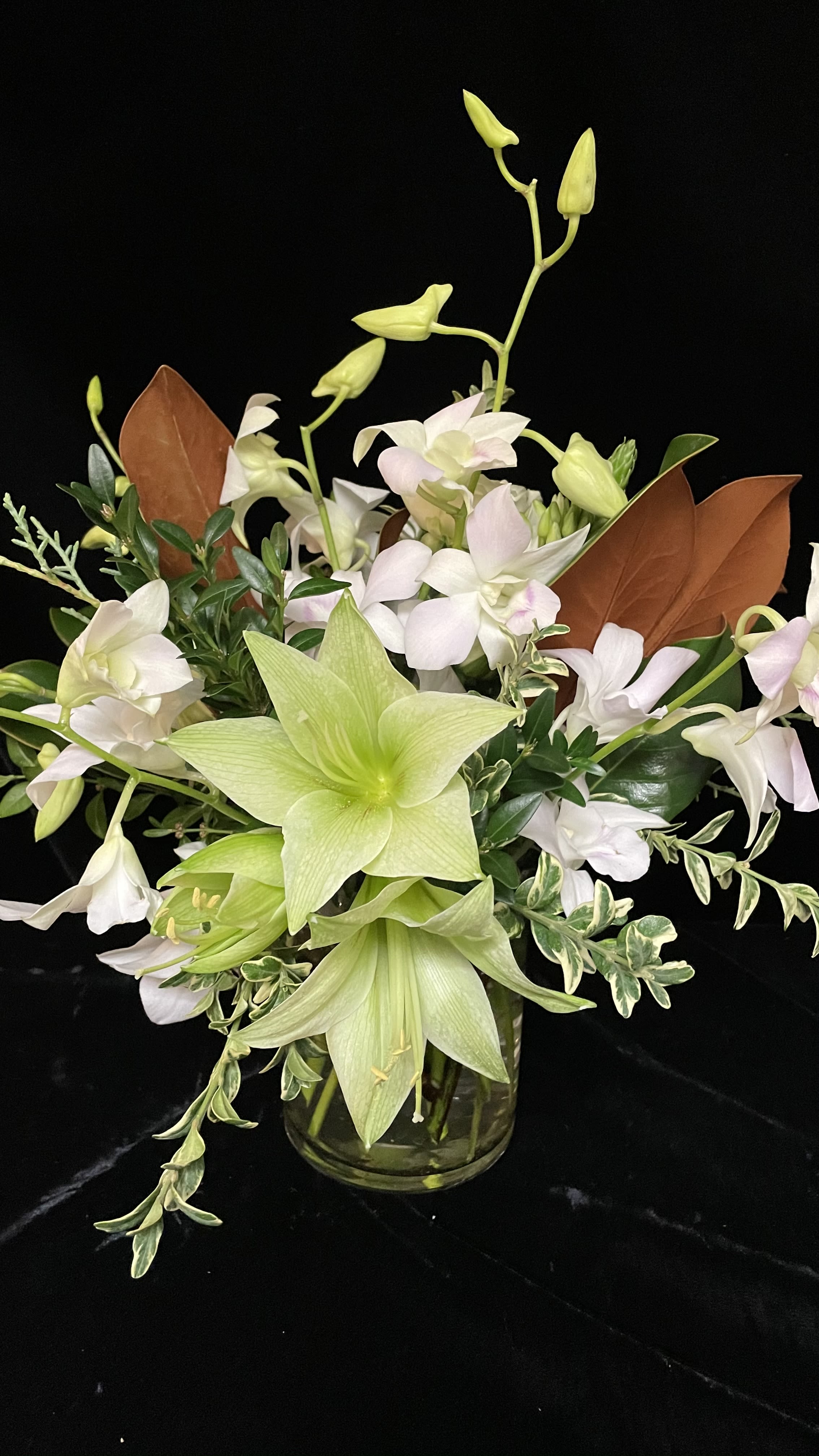 White Christmas - An elegant Holiday centerpiece with orchids and amaryllis