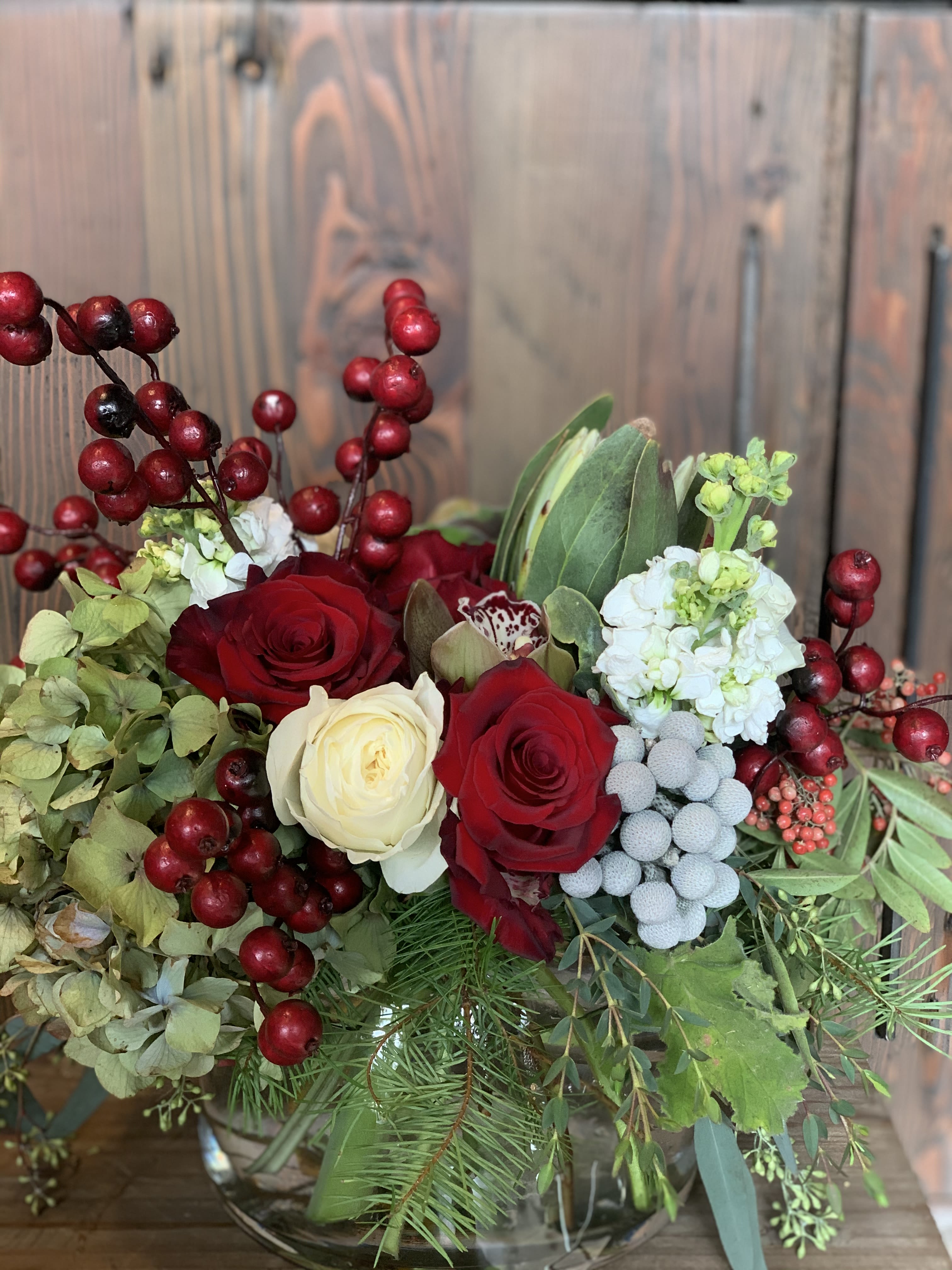 Winter Bells  - Traditional Christmas mix featuring hydrangeas, roses, berries and evergreens.  Fresh and lively bunch to brighten the holidays!