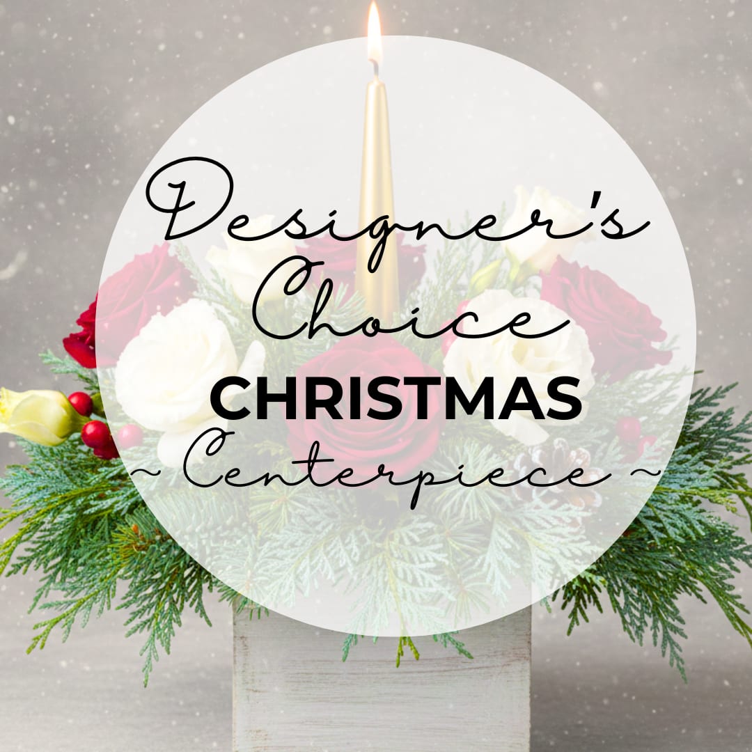 Designer's Choice Christmas Centerpiece - The Designer’s Choice Christmas Centerpiece  Let our floral artists curate something truly special for your home. This "Designer’s Choice" arrangement features a signature blend of seasonal textures—think feathery Cypress Pine and velvety blooms—nestled in a rustic whitewashed wooden box. Finished with a striking gold taper candle, it’s a bespoke piece designed to bring light and holiday warmth to any space. Each design will be unique and will feature a traditional Christmas palette of Red, Green, White, and Gold. 