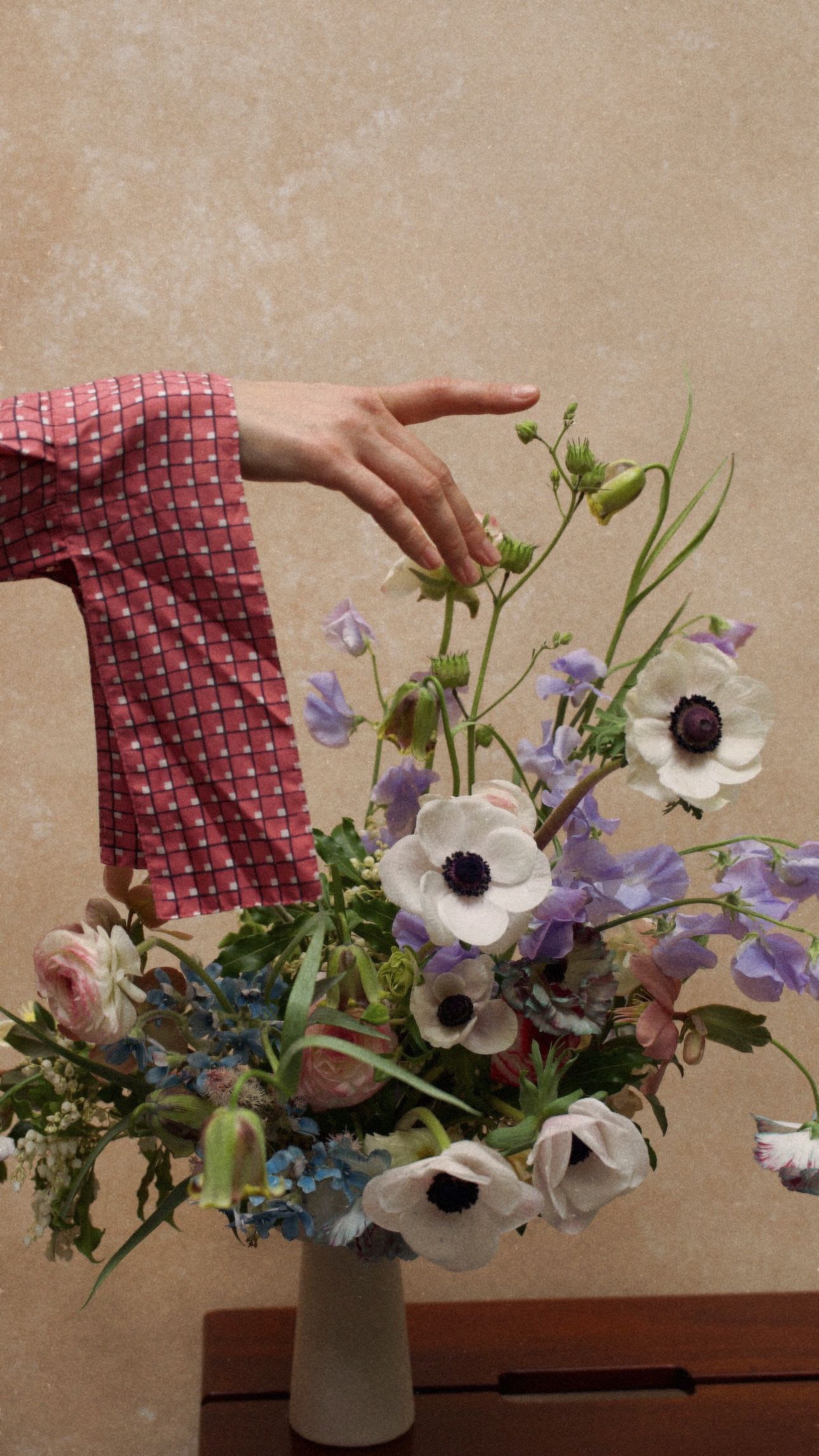 The Manhattan Glow - A glowing, earthy arrangement in rich purple, blue and green tones, with anemone accents when available. Seasonal flowers may vary, while the color palette and overall style remain consistent.