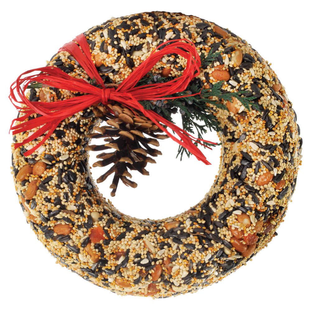 Mr. Bird Wildfeast Wreath - Solid seed, nut, and fruit wreath that is almost to good to give to the birds. Nice presentation in tray. 9″ dia.  Hang with raffia bow or provided net. Our primary goal at Mr.Bird is to make a product that is attractive to the BIRDS! Because the birds love it, you will love it. What could be better than seeing more birds and a greater variety of birds in your yard.