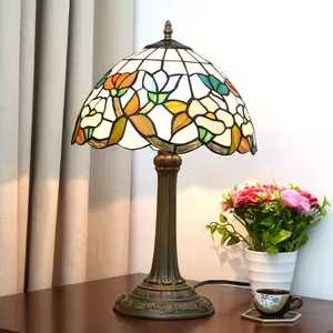 Baroque Floral Garland Tiffany Memory Lamp - This delightful Baroque Floral Garland tiffany lamp is teaming with flowers in shades of white, blue, green, and teal. 19 Inches in Height and 12 Inches in Diameter 