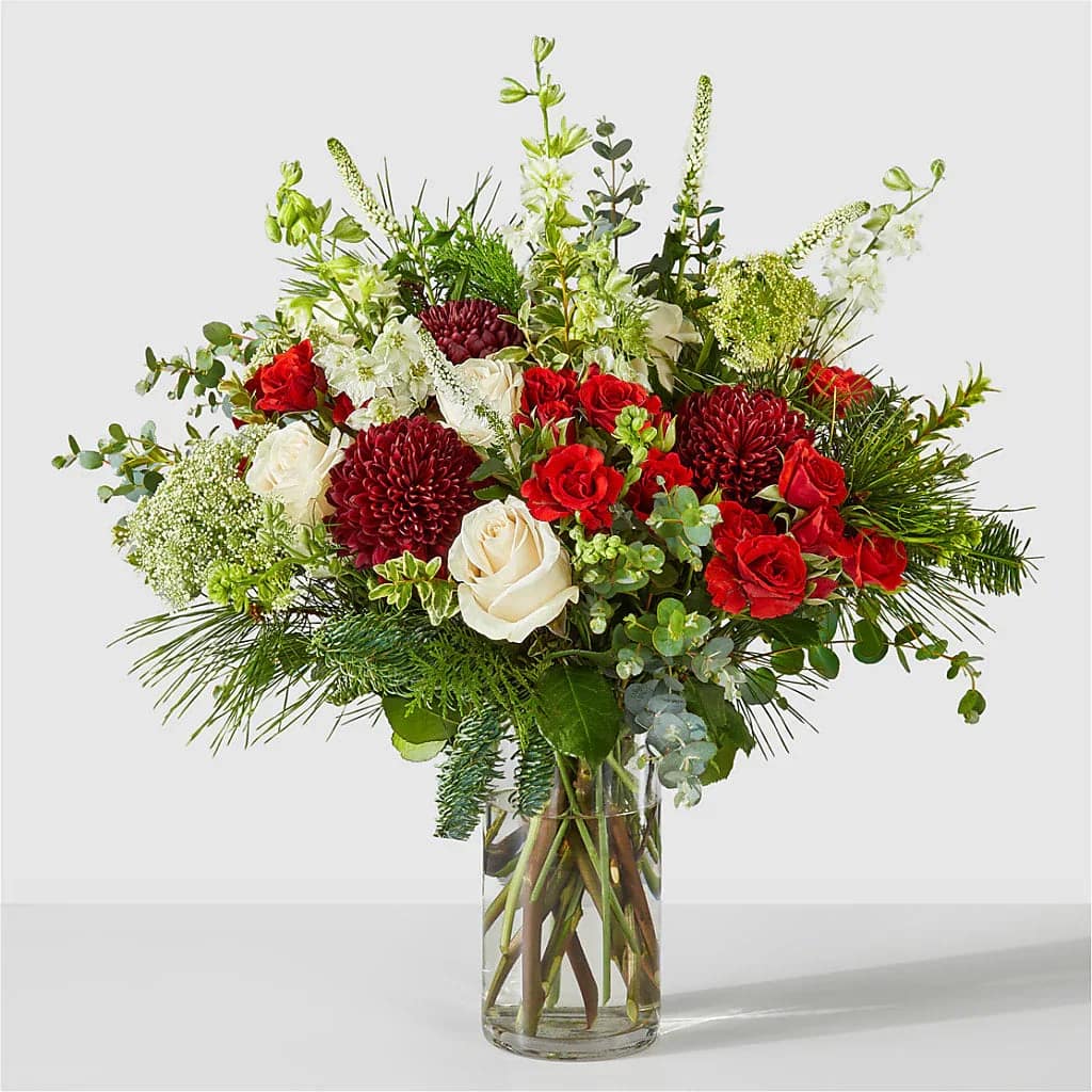 Favorite Traditions  -  Ivory roses, and pops of red make a lovely gift as a show of sympathy, a holiday greeting, or simply to brighten their day.