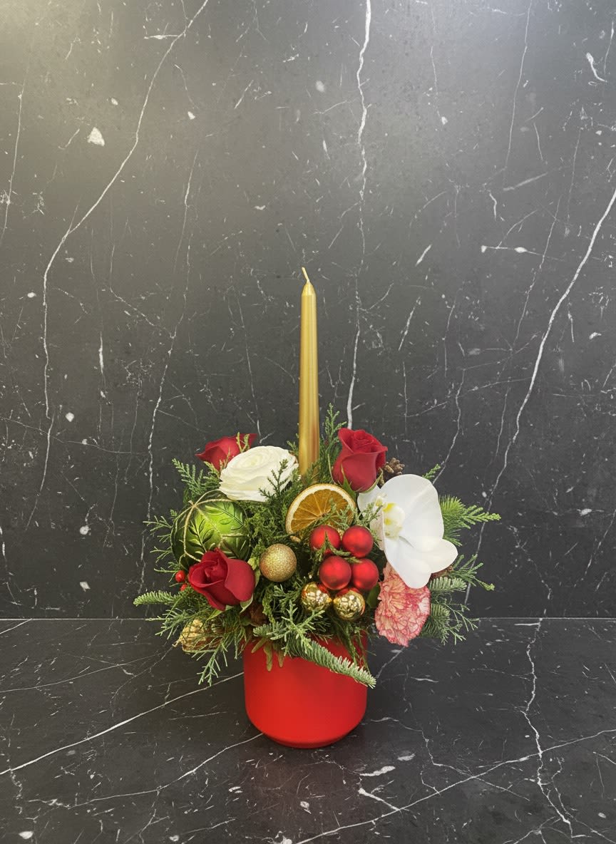 Festive Candle Arrangement - A charming holiday floral arrangement featuring fresh red roses, seasonal evergreens, decorative accents, and a single elegant candle. Perfect for holiday tables ,gifts ,or cozy winter decor. This listing is for ONE floral arrangement. If you would like multiple pieces, please contact us. 