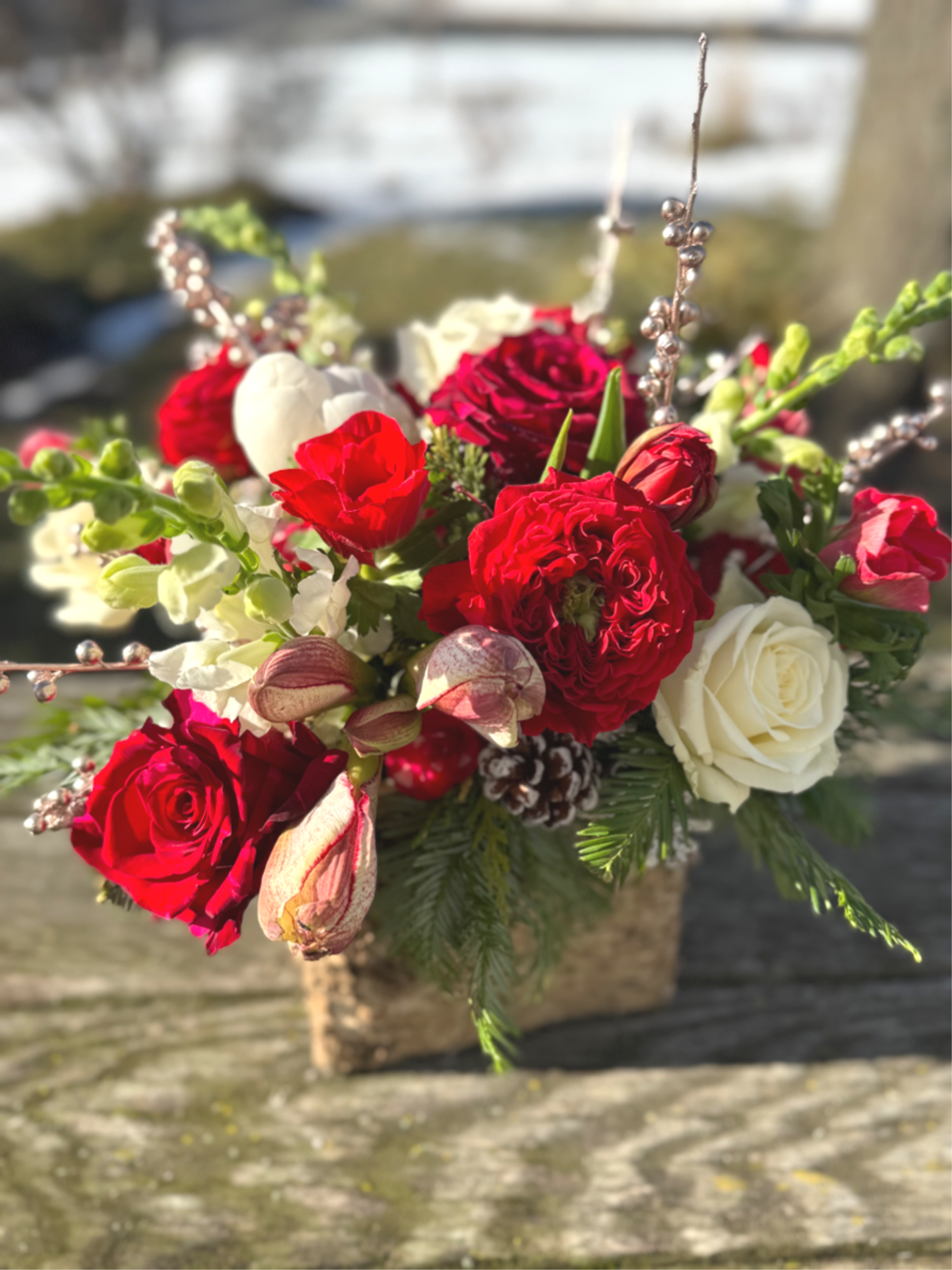 The Birch Beauty  - Natural birch meets natural holiday beauty.  Each 6x6 birch box is filled with beautiful fresh flowers- we will use amaryllis by the stem and/or peony (pending what's avail), roses, tulips, ranunculus, anenome and a few other seasonal goodies and greens.  Its so beautiful and can be used as decor at your doorstep as we offer these in multiples!  Standard = 1x arrangement Deluxe= 2x arrangements (1x for table and 1x for the island or coffee table) Premium 3x arrangements (run down a rectangle table, gift one, add to your foyer, coffee table or guest room!)  