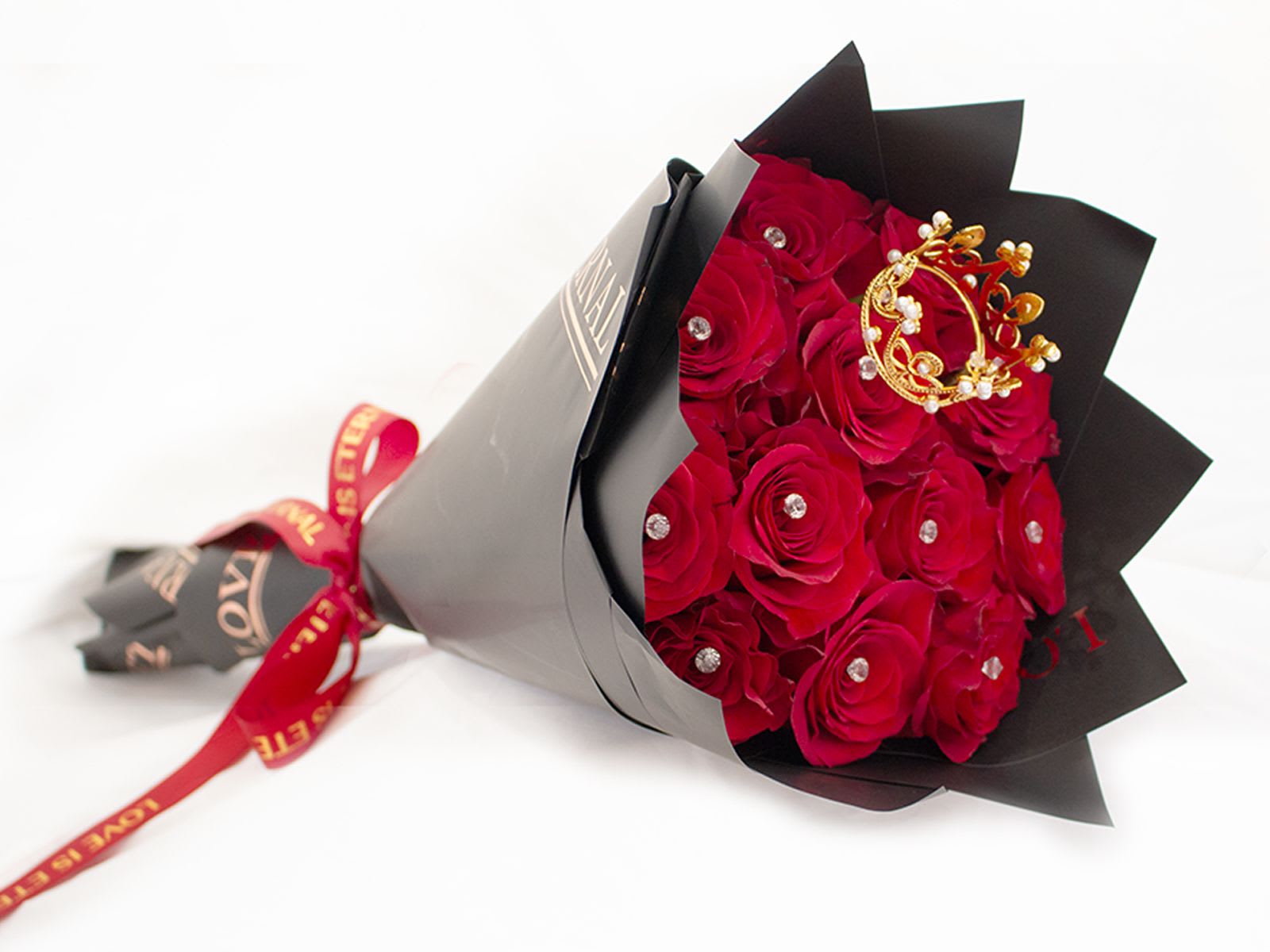 13 Roses Ramo Buchon with Crown &amp; Diamonds  - Our hand-tied bouquets are delicately arranged combining pure Ecuadorian roses top with a diamond on each rose and a crown. 