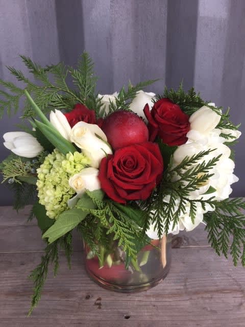 Holiday Spirit  - Holiday flower arrangement with red/ whit/ green flowers and red apples 