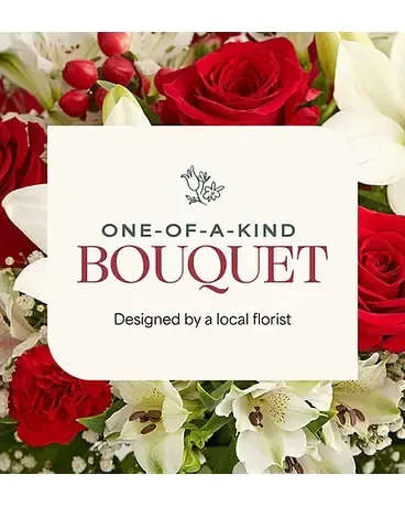 Holiday Florist Choice - Let our designers create a one-of-a-kind holiday arrangement using the freshest seasonal flowers available. Each piece is thoughtfully styled with festive accents and greenery, making it a perfect gift or centerpiece. Colors and flowers will vary, but the result is always beautiful and holiday-inspired.