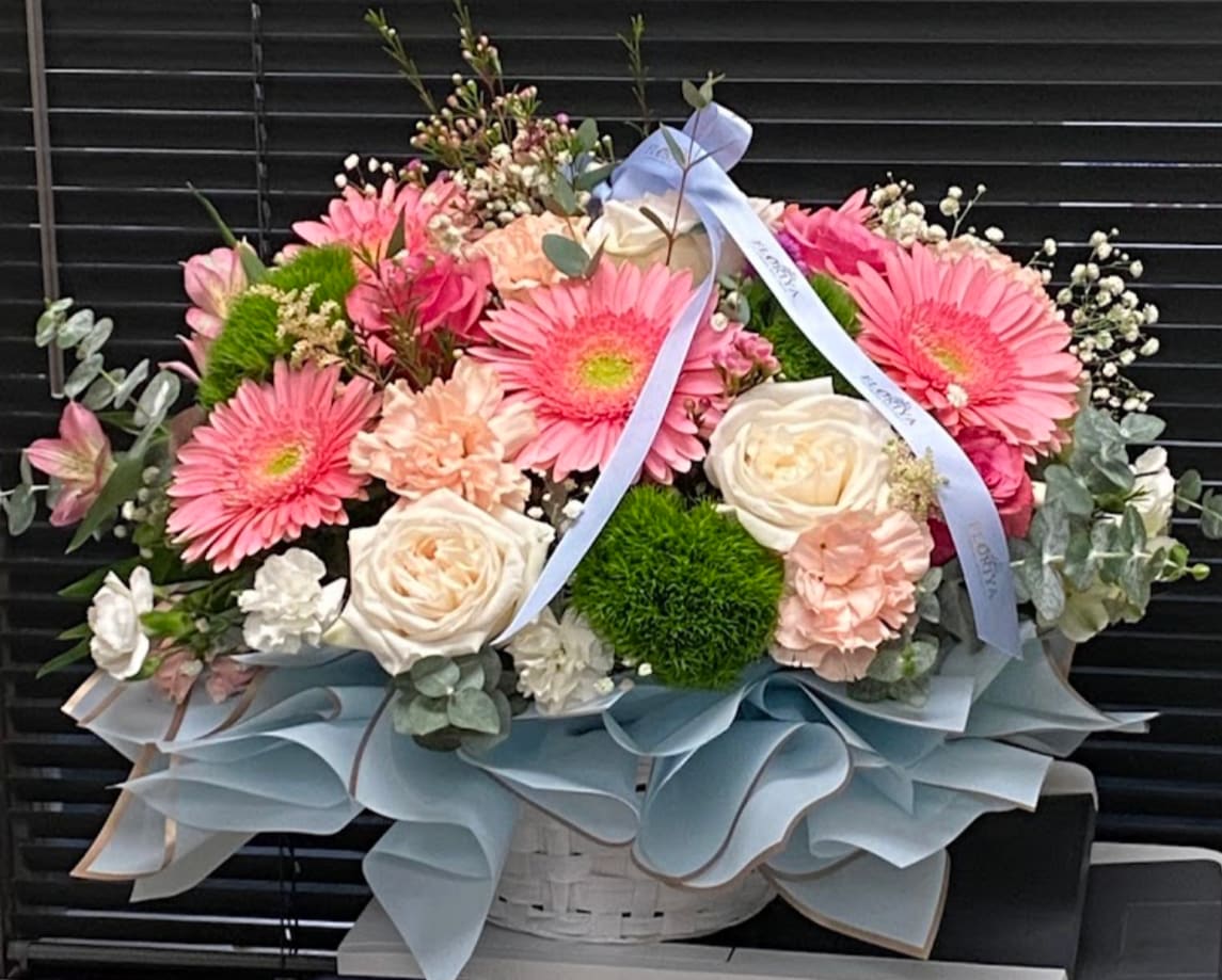 Bloom Basket - Beautiful flower arrangement featuring fresh pastel flowers, mixed roses and daisy arrangement created for special occasion flowers in a soft romantic floral style designed with care.