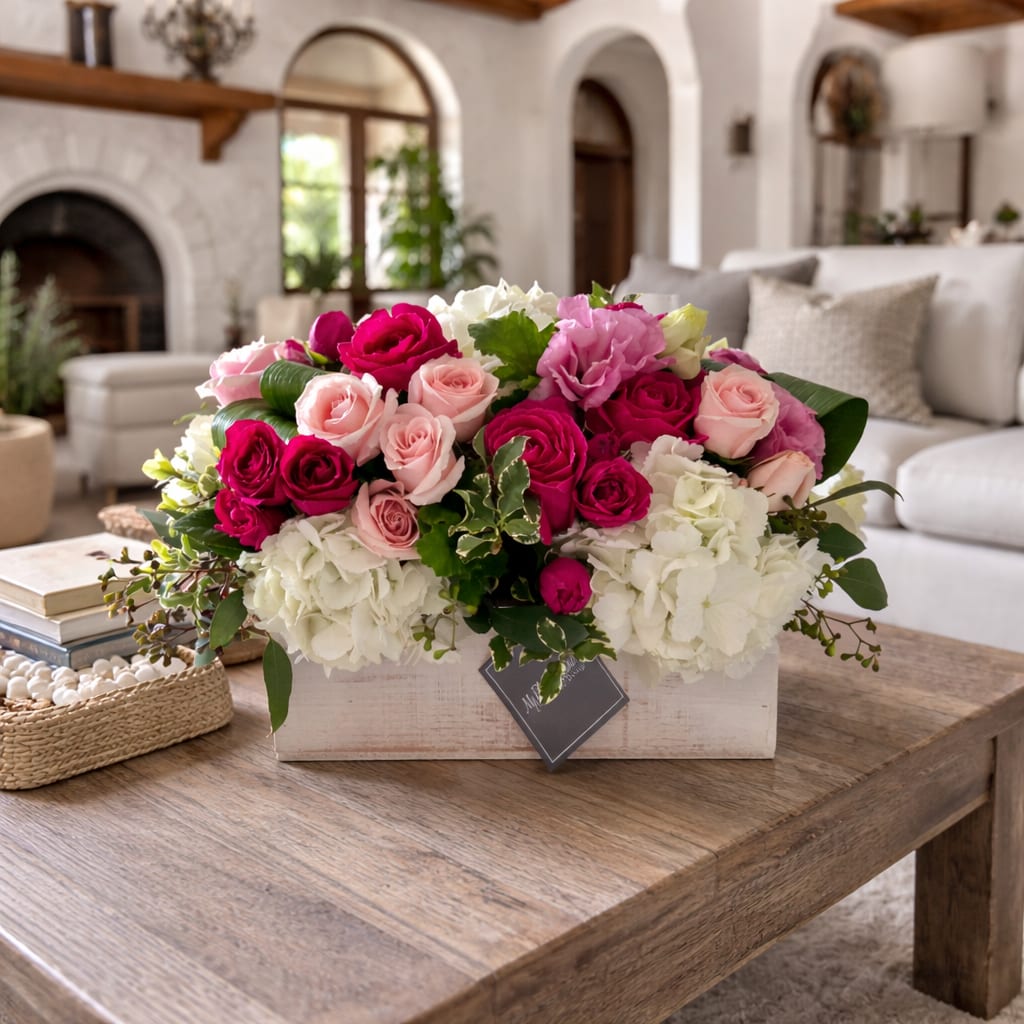 Expressions of Pink - Expressions of Pink Floral Arrangement  Soft, romantic, and beautifully expressive, Expressions of Pink is a timeless floral arrangement designed to make every moment feel special. This lush design features a stunning mix of vibrant hot pink roses, delicate blush roses, and fresh white hydrangeas, thoughtfully accented with seasonal greenery for added texture and movement. Arranged in a charming rustic wooden box, this piece blends classic elegance with modern style.  Perfectly styled for a coffee table or centerpiece, Expressions of Pink brings warmth and sophistication into any space. Whether you’re celebrating a anniversary, baby shower, or simply sending love “just because,” this arrangement delivers heartfelt beauty and unforgettable charm.  Handcrafted by our expert florists using premium, fresh flowers, each arrangement is created with care to ensure long-lasting beauty and maximum impact.  Perfect for:   Anniversaries  Baby Showers  Thank You Gifts  Home Décor &amp; Centerpieces  Why you’ll love it:  Premium roses and hydrangeas  Soft pink and white color palette  Rustic wood box for a modern yet timeless look  Designed and hand-arranged in Los Angeles   At My Blooming Business, we deliver smiles—one bloom at a time.