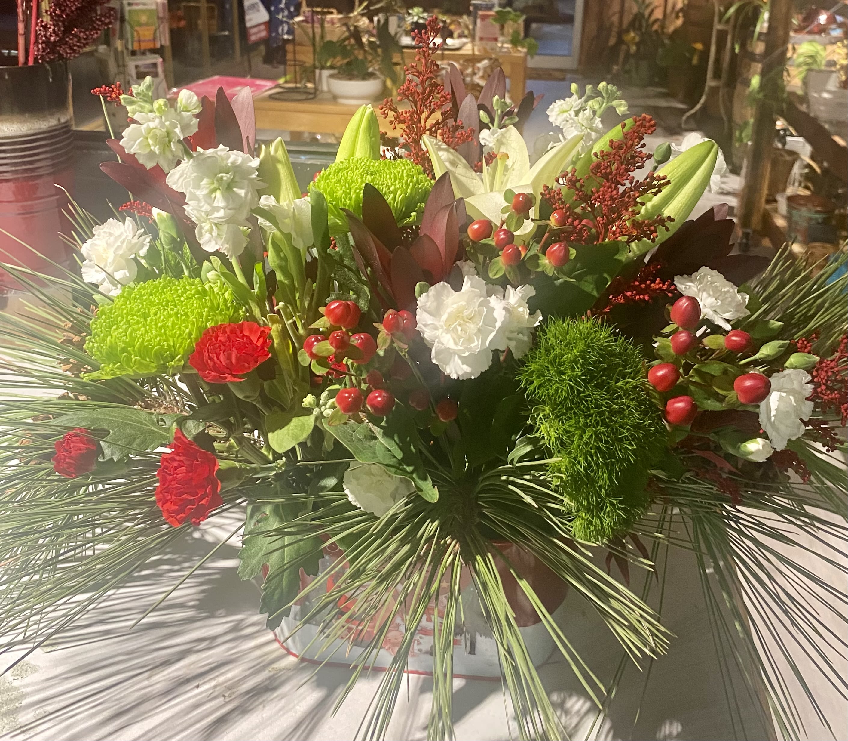 Christmas centerpiece  - Evergreens, red and white flowers