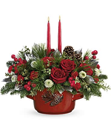 Christmas Heirloom Centerpiece - (LIMITED QTY style by Teleflora) - Reminiscent of a family heirloom, this stunning stoneware serving dish is food-safe for stylish seasonal entertaining. It's the perfect presentation for an elegant Christmas rose bouquet! Red roses, red carnations, miniature red carnations and white button spray chrysanthemums are arranged with noble fit, white pine, oregonia and lemon leaf. Delivered in Teleflora's Vintage Stoneware Bowl. Orientation: All-Around