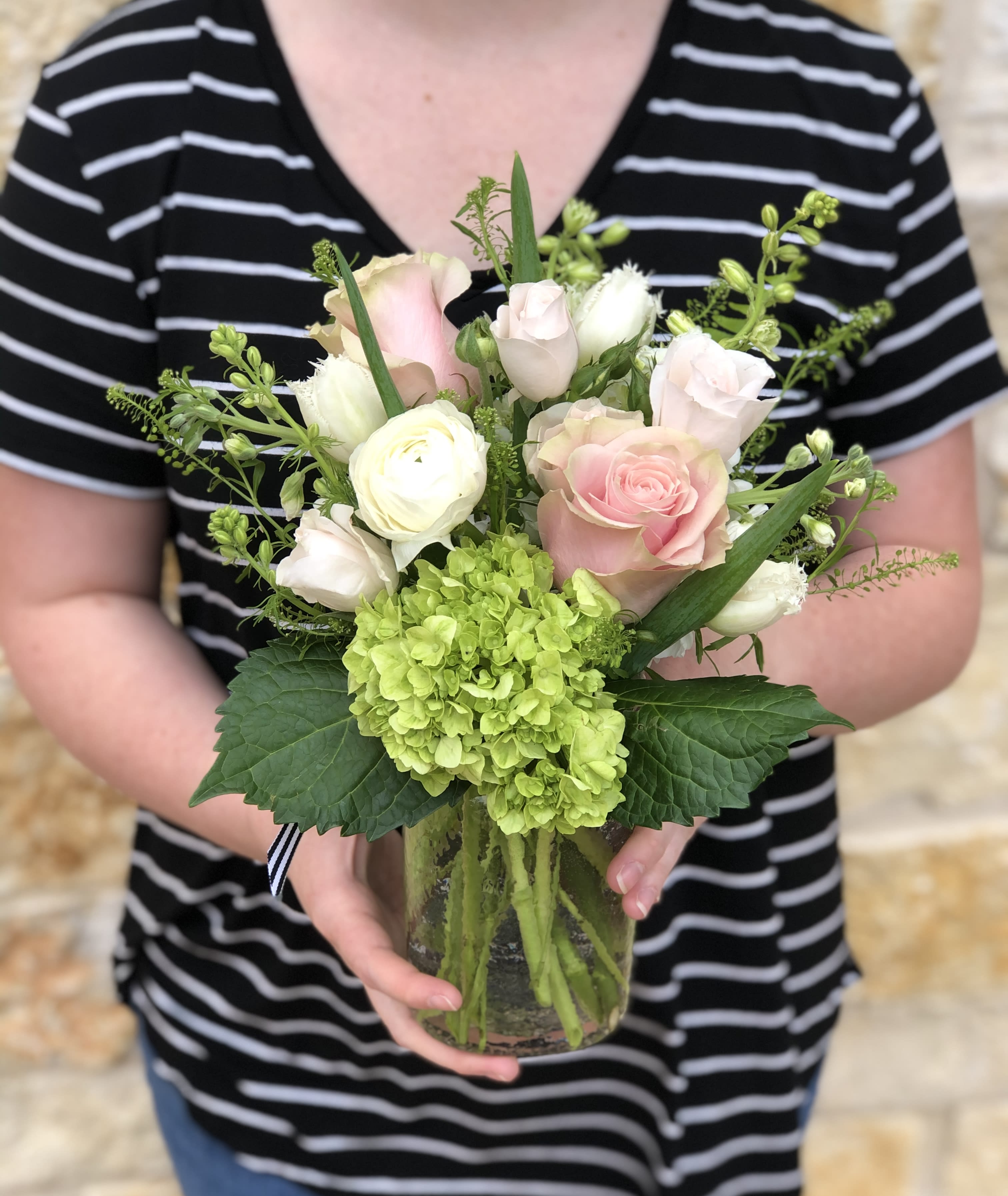 Blush Bloom Jar - A garden mix with season's prettiest soft pink and white blossoms. Arranged in our clear glass Bloom Jar.             Overall design is approximately 12" tall.   Floral varieties may vary but will be of similar quality and style.  