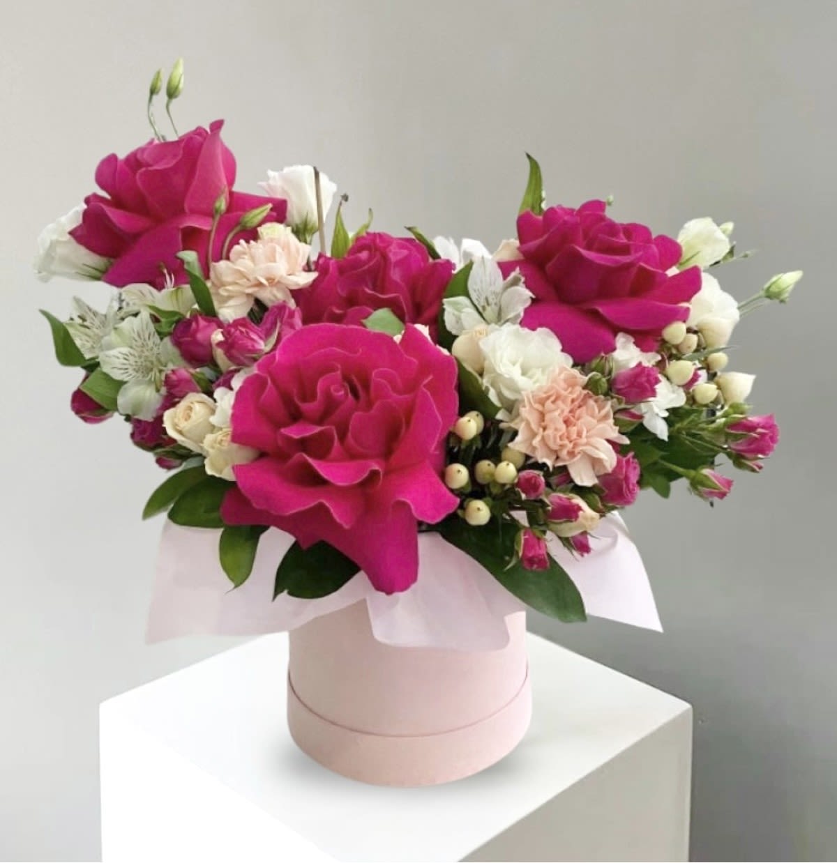 Love Bug - This elegant floral arrangement features a beautiful blend of pink flowers in soft blush, pastel, and deeper rose tones, thoughtfully layered to create depth and movement. Each bloom is carefully placed to highlight its natural shape and texture, while fresh greenery adds balance and a touch of freshness. The gentle color palette creates a soothing, romantic feel, making the arrangement both graceful and inviting. Perfect for birthdays, celebrations, or simply brightening a space, this pink arrangement expresses warmth, tenderness, and timeless beauty, leaving a lasting impression of charm and elegance.