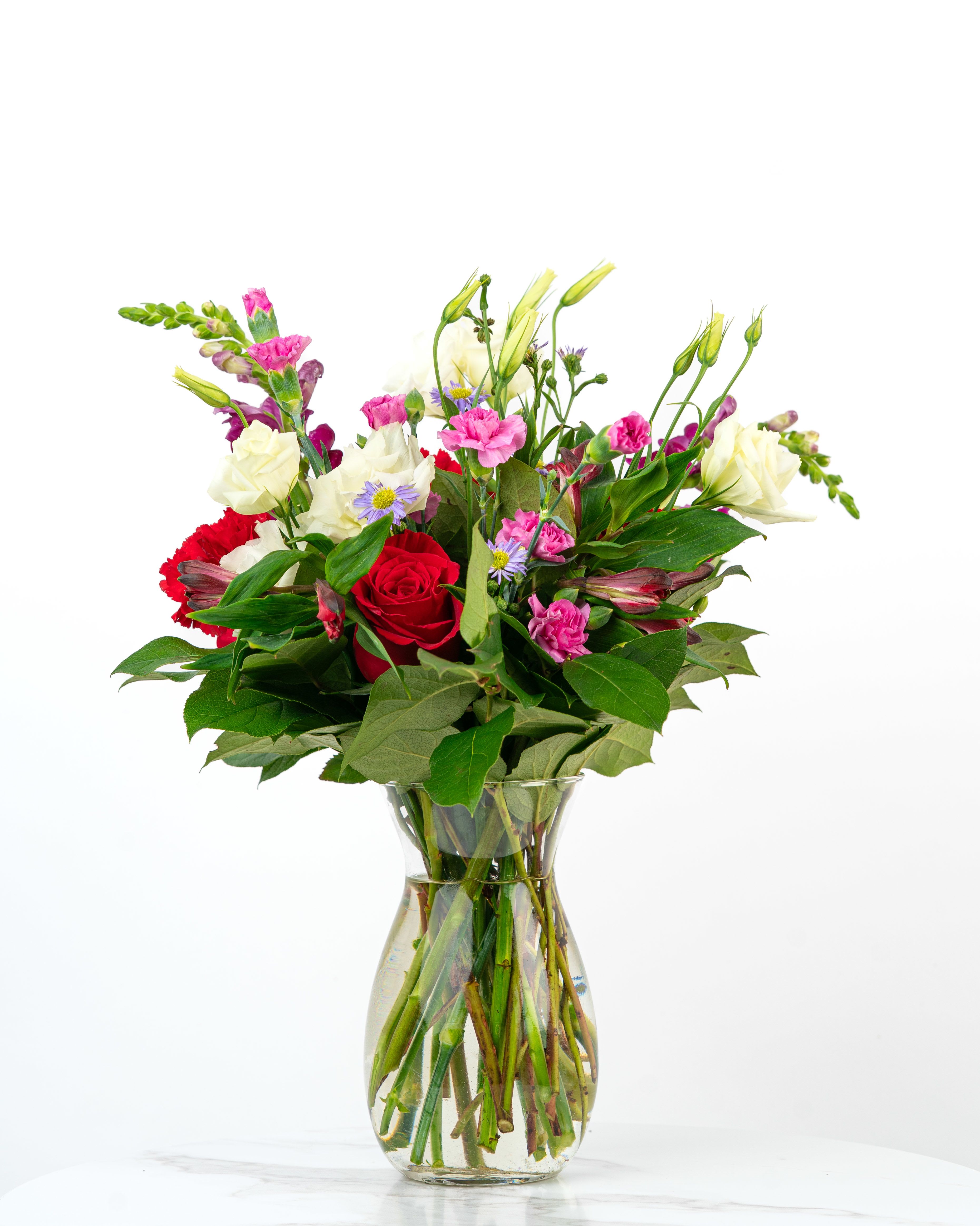 Our Timeless Collection: Bold Blooms - Our Timeless Collection's Bold Blooms features elegant blooms in rich, deep tones to evoke lasting beauty and classic romance. This color-rich floral arrangement is intended to celebrate someone special with timeless beauty and style. At Schultz Floral, each arrangement is one of a kind and styled just for your order. Because we always use the freshest blooms, your final arrangement may not look exactly as pictured due to seasonal availability.