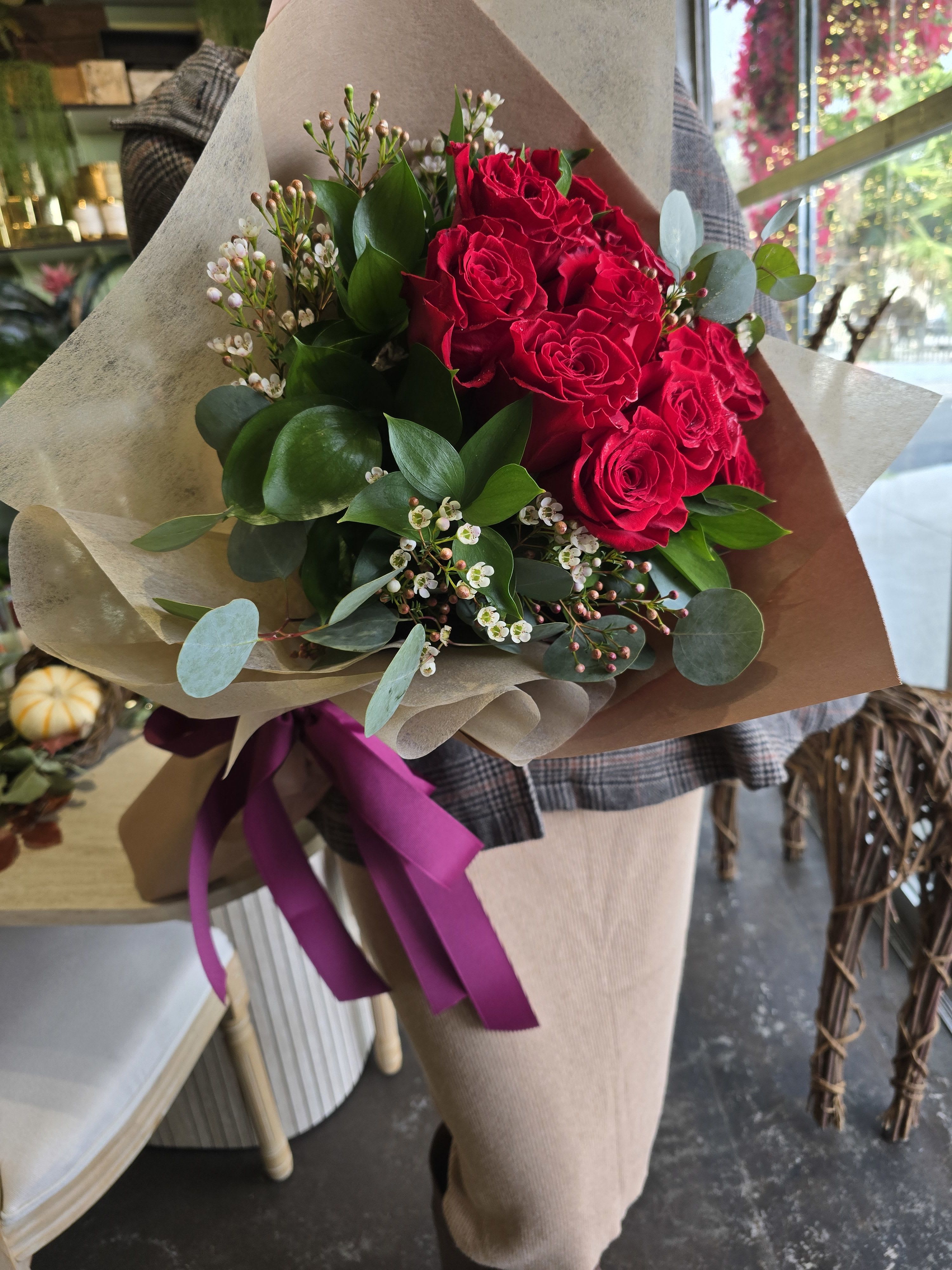 The Parisian Romance: Hand-Tied Red Rose - Bring the timeless elegance of a European flower market into your home with The Parisian Romance. This signature hand-tied bouquet from Dave’s Flowers features premium, long-stemmed red roses known for their deep velvet texture and high petal count. Accented with delicate white waxflowers and lush eucalyptus greenery, this arrangement is a masterclass in organic, sophisticated design.