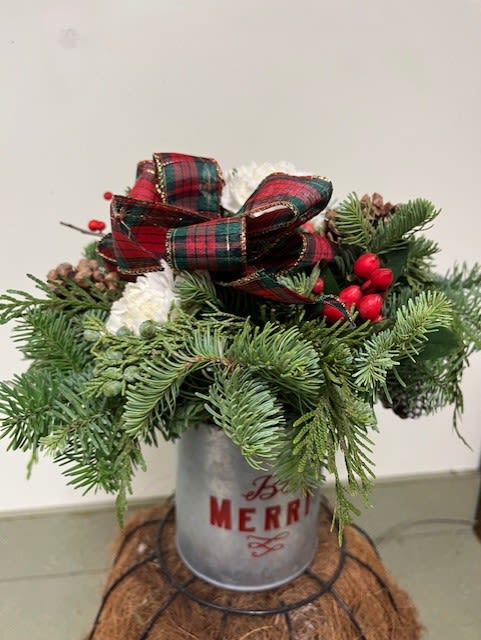 Be Merry Bouquet - A stenciled tin containing a fresh assortment of balsam fir and Port Orford cedar along with bright holiday carnations, red berries, and a festive bow.  (local pickup and delivery only)