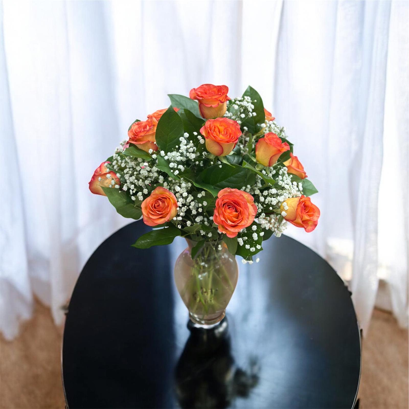 Skyfire of Love Rises in clear vase  - Beautiful orange yellowish roses with baby breath and greenery 
