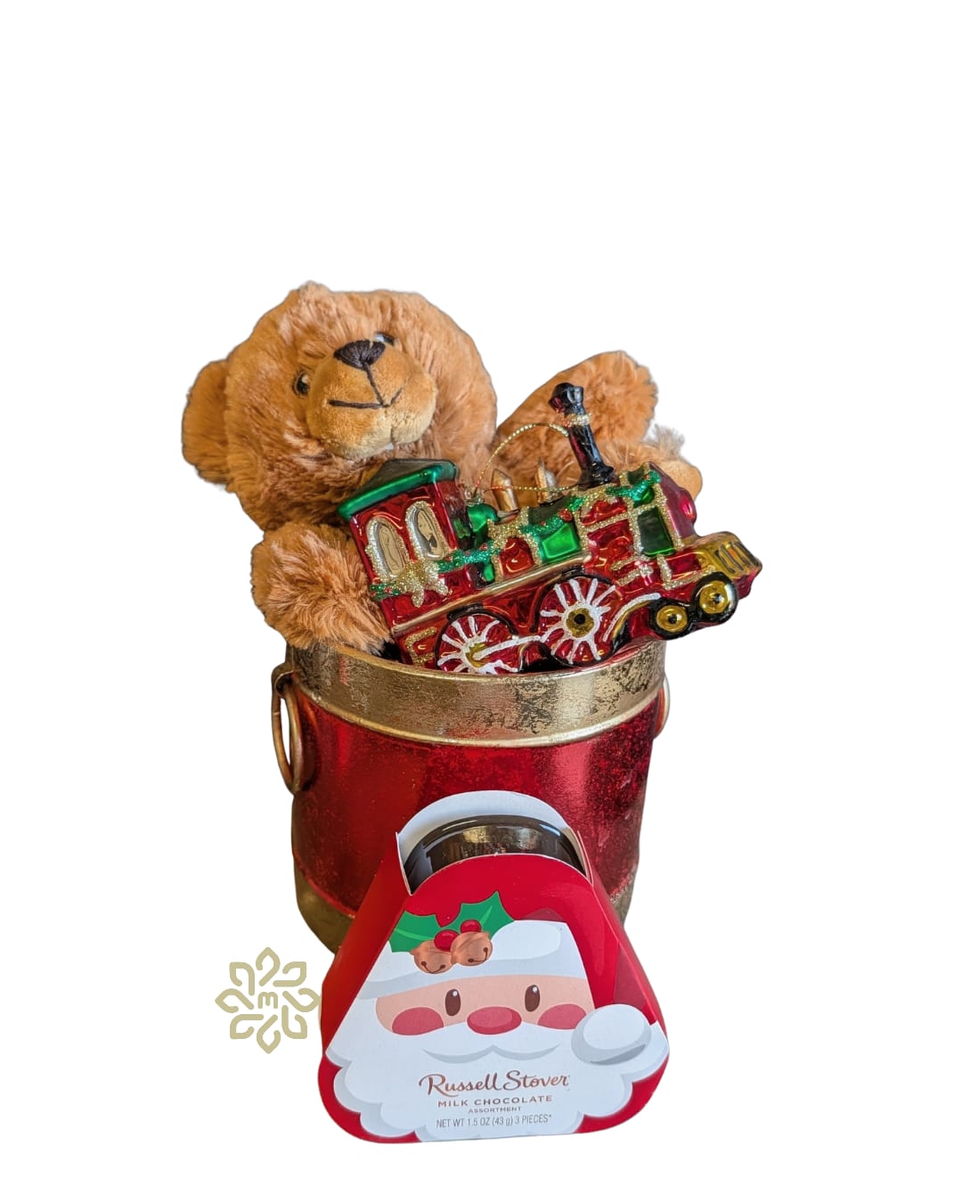 Engineer Teddy Holiday Gift Set - Delight kids and adults alike with our Engineer Teddy Holiday Gift Set, a charming gift bundle that’s perfect for Christmas gifting, winter birthdays, and holiday thank-yous.  This festive Christmas gift set includes:  -Plush Mini Teddy Bear – Soft, cuddly, and perfectly sized.  -Decorative Collector Train Christmas Ornament – A colorful, keepsake-quality train ornament that adds nostalgic charm to any Christmas tree or holiday décor.  -Mini Box of Russell Stover Chocolates – Classic, indulgent chocolates from a beloved brand, ideal for a sweet holiday treat. 1.5 oz  -Festive Red Drum Container – A reusable, drum-style container that adds a whimsical holiday touch and can be repurposed for décor or storage.  This holiday teddy bear and chocolate gift set pairs beautifully with fresh flowers or a seasonal centerpiece, making it an easy, ready-to-give option.